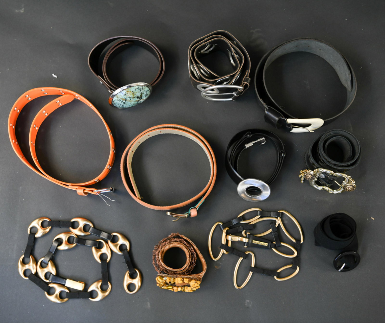 GROUPING OF DESIGNER BELTS INCL. LEATHER: Vince Camuto, Michele Monroe, Suzi Roher, Chico’s, Leatherrock, etc Size: S-M 38-40