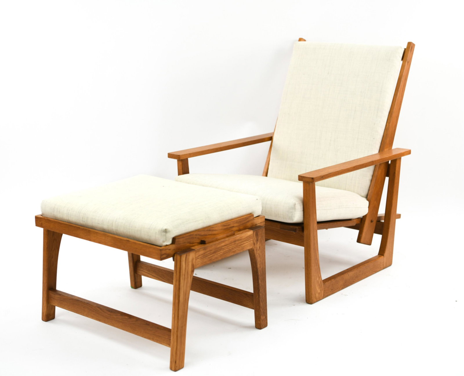 MID-CENTURY DANISH OAK LOUNGE CHAIR & OTTOMAN: Reclining chair. Freshly upholstered in wool. Tray top ottoman. Dimensions: H 36" x W 29" x D 33" x SH 17" Condition: Only light signs of age and use.