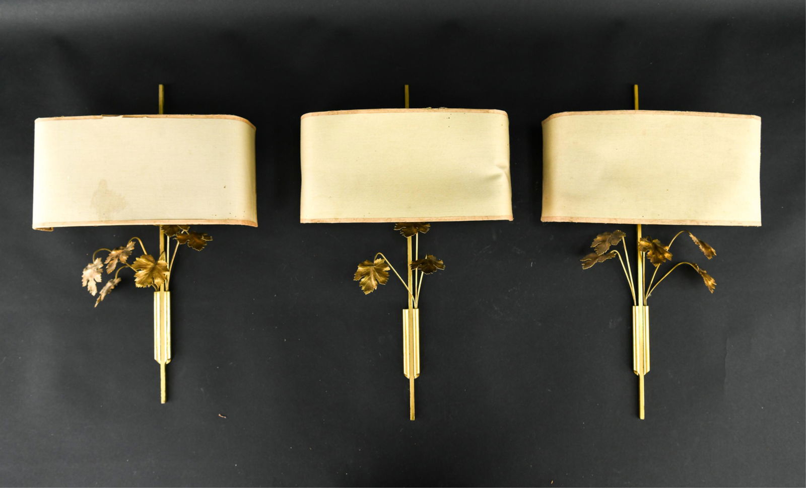 MID-CENTURY FRENCH BRASS LEAF FORM WALL SCONCES: Dimensions: H 17" x W 10" x D 4" Condition: Some light surface corrosion. Shades toned and stained.