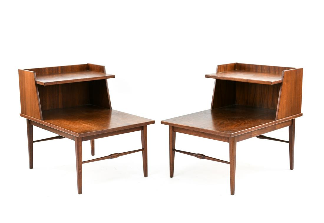 PAIR MILO BAUGHMAN STYLE TIERED WALNUT SIDE TABLES: Dimensions: H 26" x W 21" x D 30" Condition: Finish wear including water marks and scratches. A few dings.