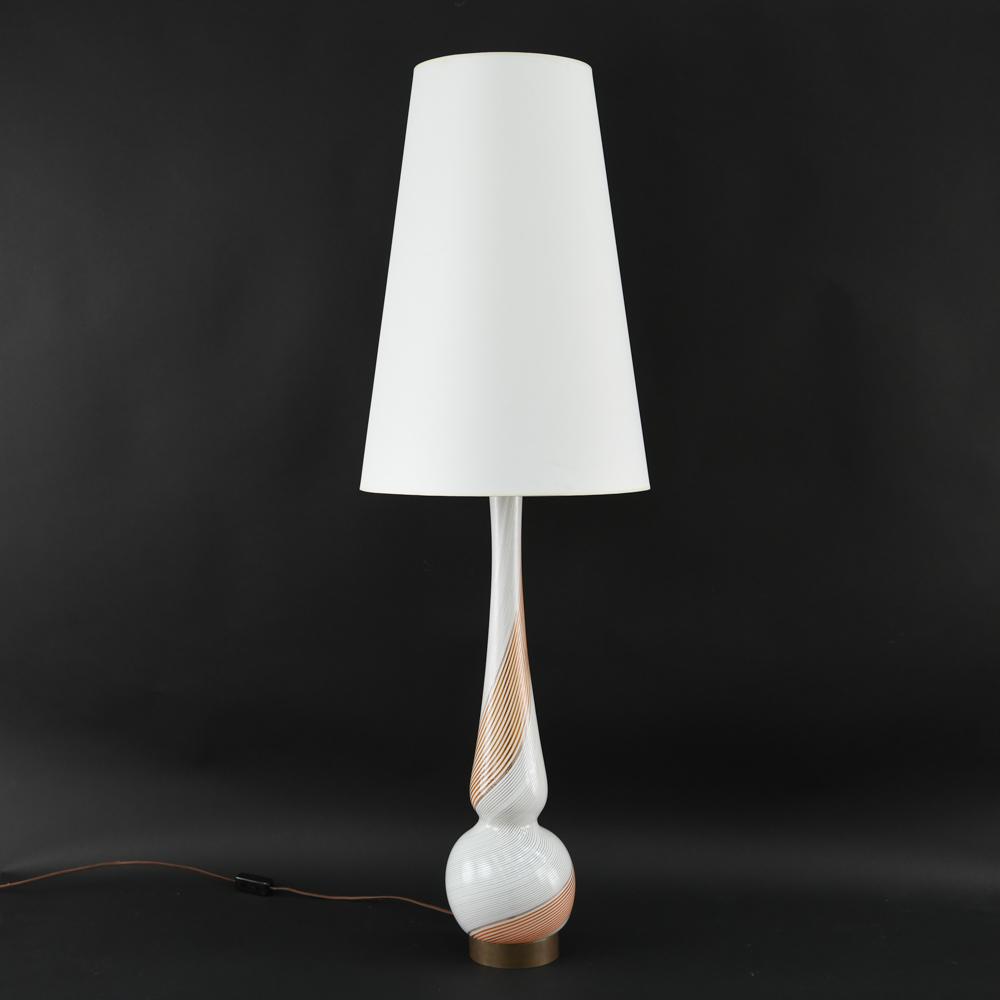 DINO MARTENS FOR AURELIANO TOSO ITALIAN GLASS LAMP: Orange, white and gold foil swirl, Made in Italy paper label. Dimensions: H 51" (to top of shade) x Dia: 6.5" (base) Condition: Showing light signs of age.
