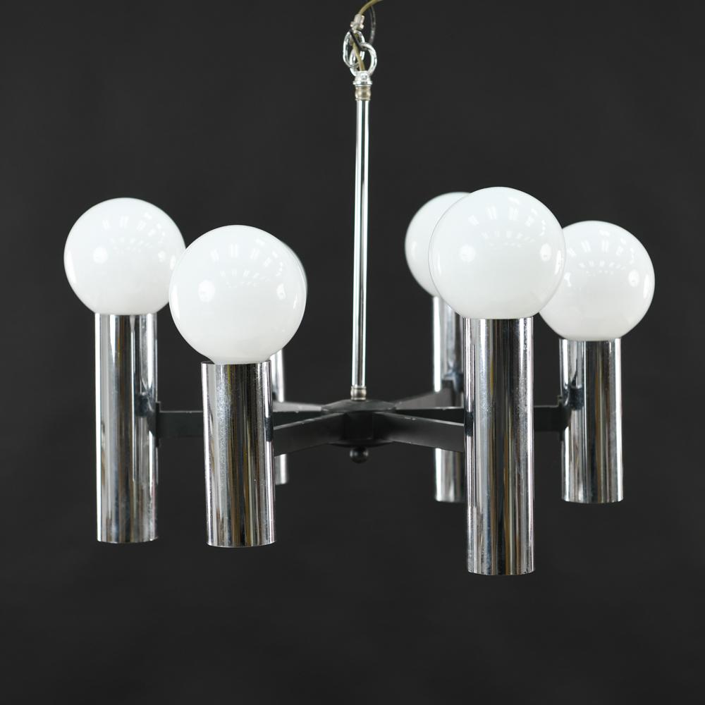 MID-CENTURY CHROME CHANDELIER: Provides up and down lighting. With 12 total fixtures. All bulbs included but not tested. Dimensions: (To canopy) H 20.5" x Dia. 24" Condition: Apparently rewired. Small losses to black paint. Not tes