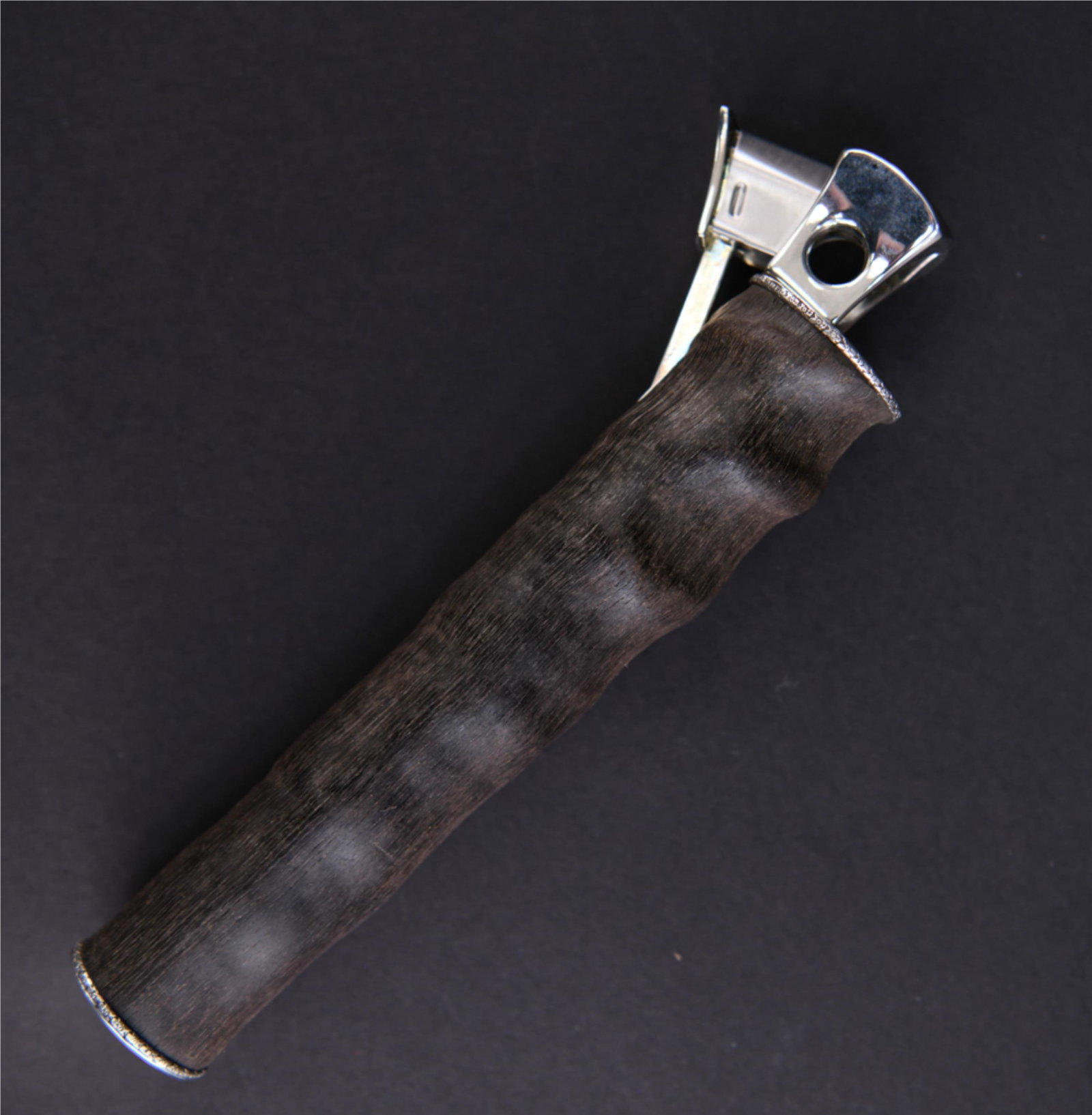 VINTAGE STERLING SILVER AND HORN CIGAR CUTTER: Mounts marked .925. Dimensions: L 8.25" Condition: No issues to note.