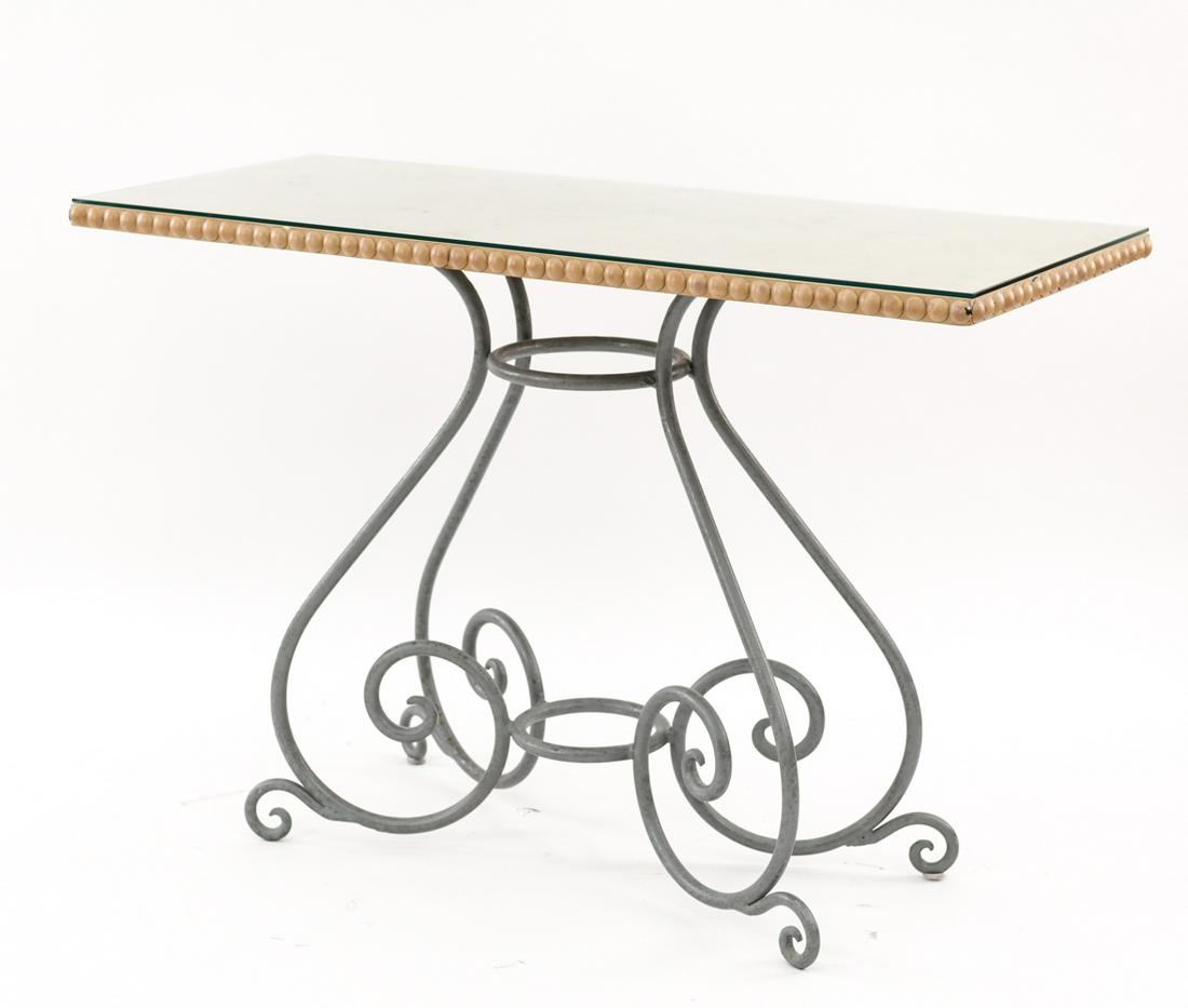 CONTEMPORARY IRON AND WOOD CONSOLE TABLE: With glass top and metal tack trim detail. Dimensions: H 32” x W 48” x D 20” Condition: No issues to note.