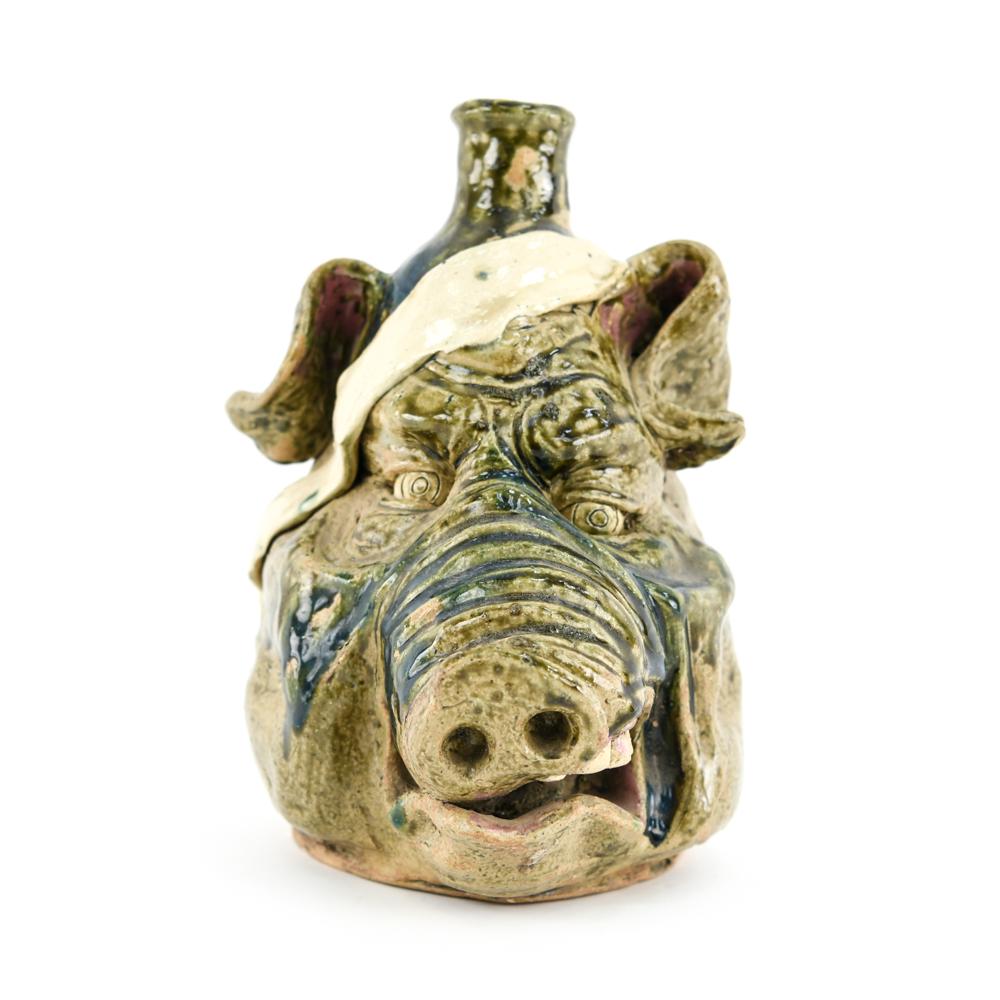 W. A. FLOWERS LARGE CERAMIC PIG FACE JUG: Earthenware, signed W. A. Flowers on back. Dimensions: H 11" x W 7.75" x D 8.75" Condition: Minor chips to edges.