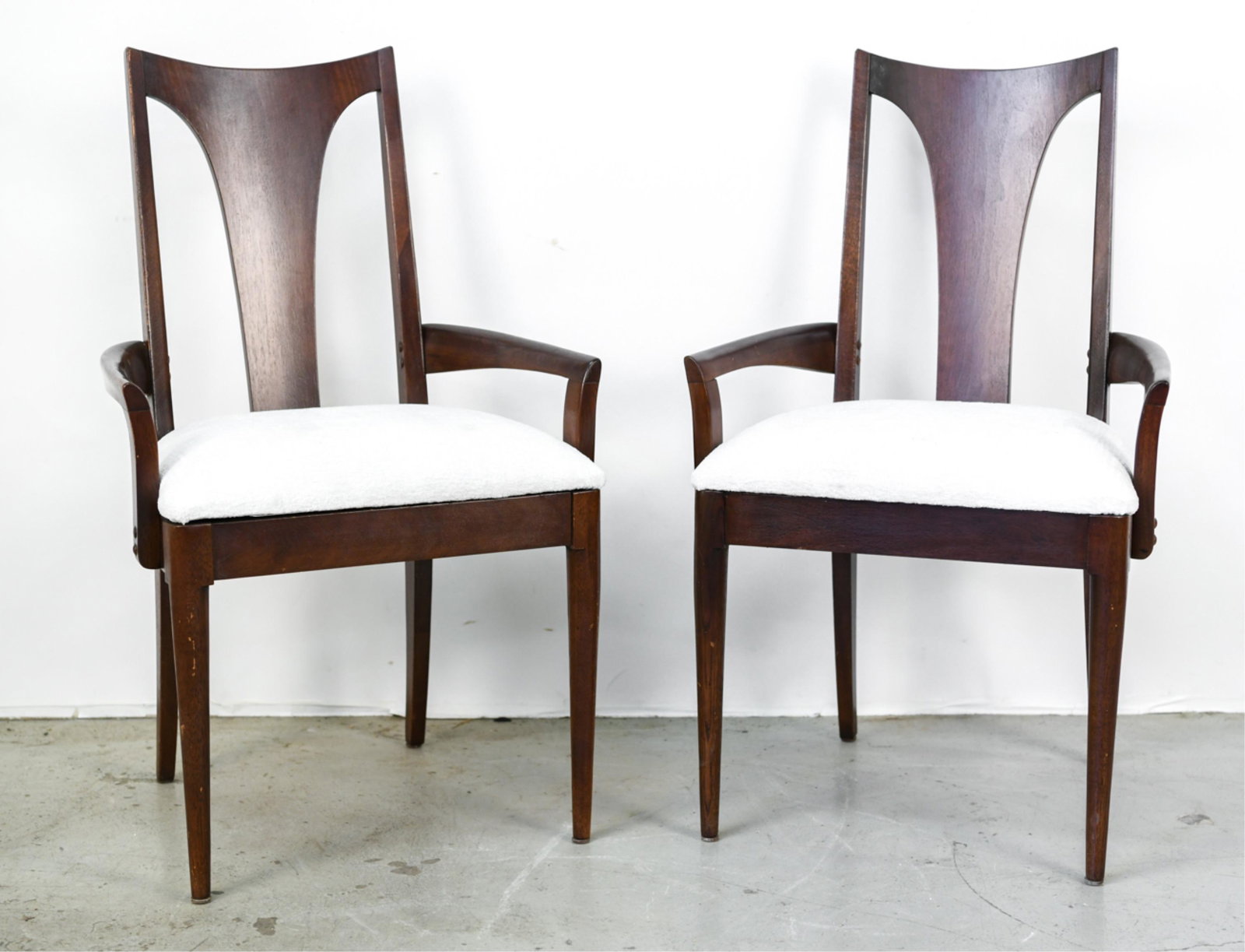 PAIR OF ARMCHAIRS: Dimensions: H 37" x W 22" x D 18" x SH 21" Condition: Some scuffs throughout. Minor spots to white upholstery.