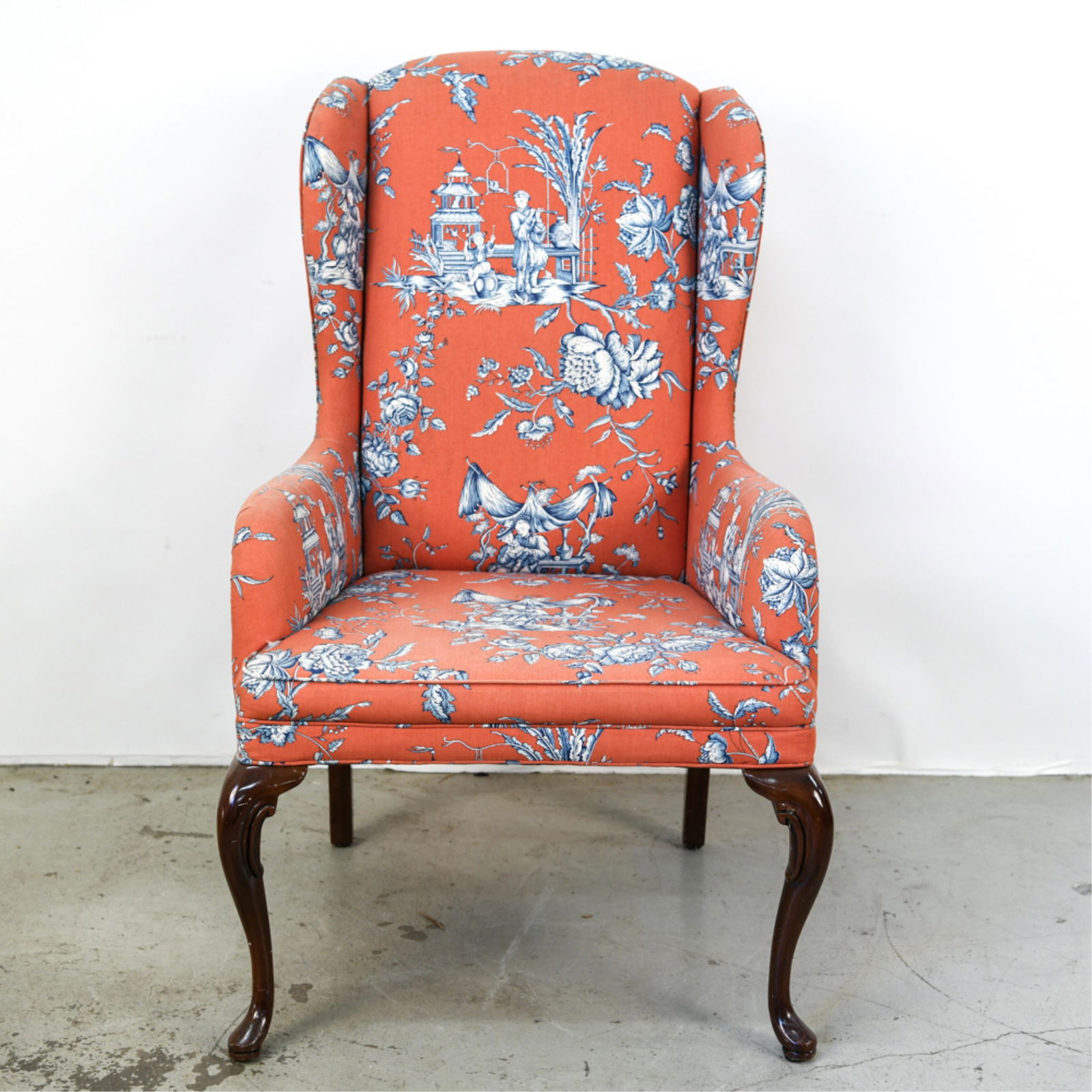 CHINOISERIE UPHOLSTERED WINGBACK CHAIR: Dimensions: H 45.5" x W 27.5" x D 27" x SH 18.5" Condition: Upholstery faded and dirty. Minor scuffs to legs.