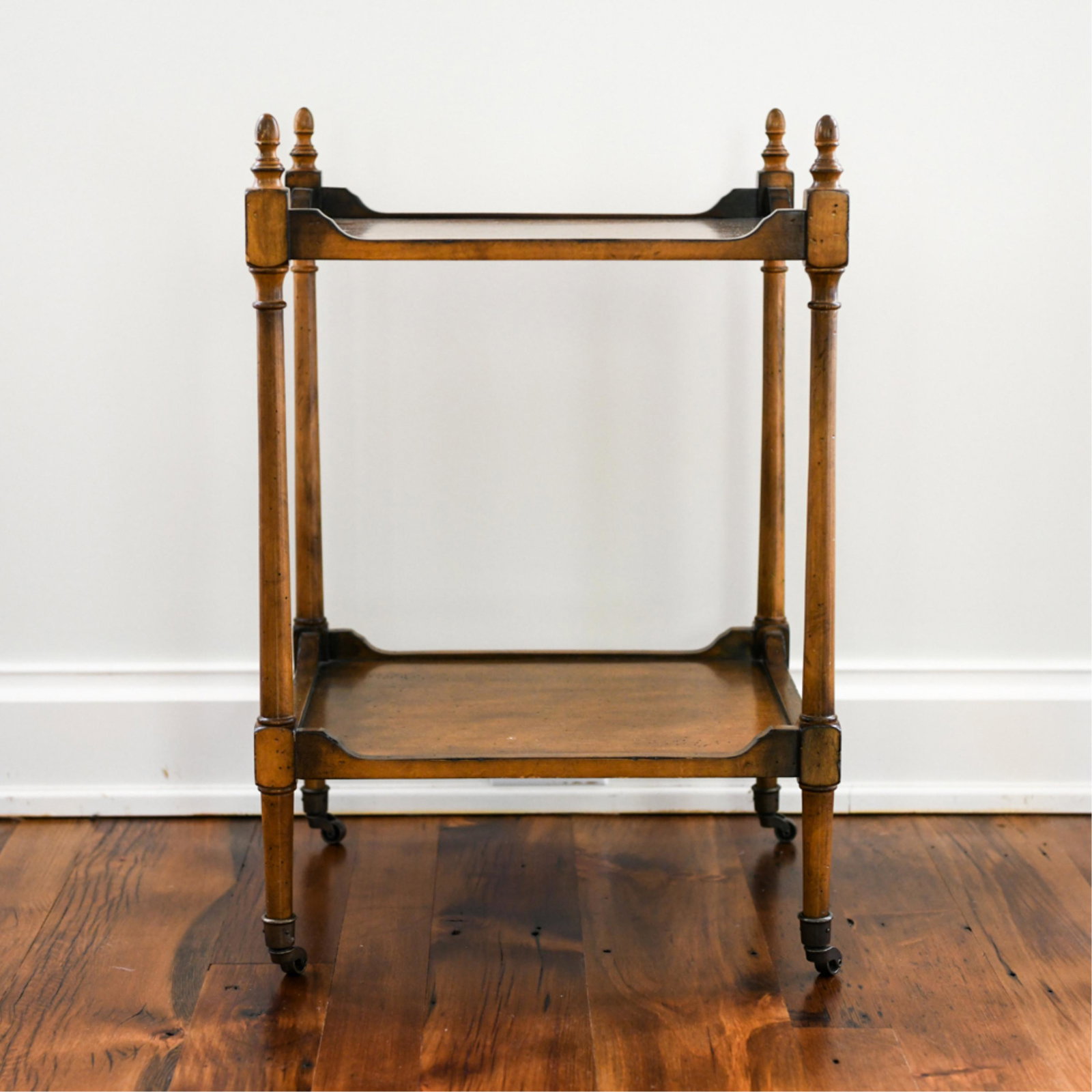 TWO-TIERED TROLLEY TABLE: Faux antiqued surface. Dimensions: H 27" x W 18" x D 18" Condition: Few surface marks.