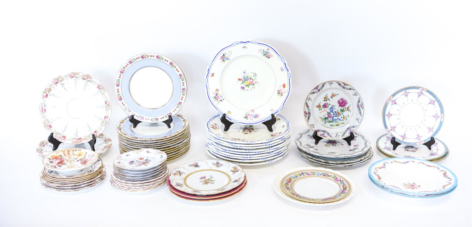 GROUPING OF FLORAL PATTERN PORCELAIN: Including Royal Crown Derby, Copeland Spode, etc. Dimensions: (Largest plate) Dia. 11" Condition: Signs of use including wear to glaze, some with hairline fractures, rubs to some edges. A couple small