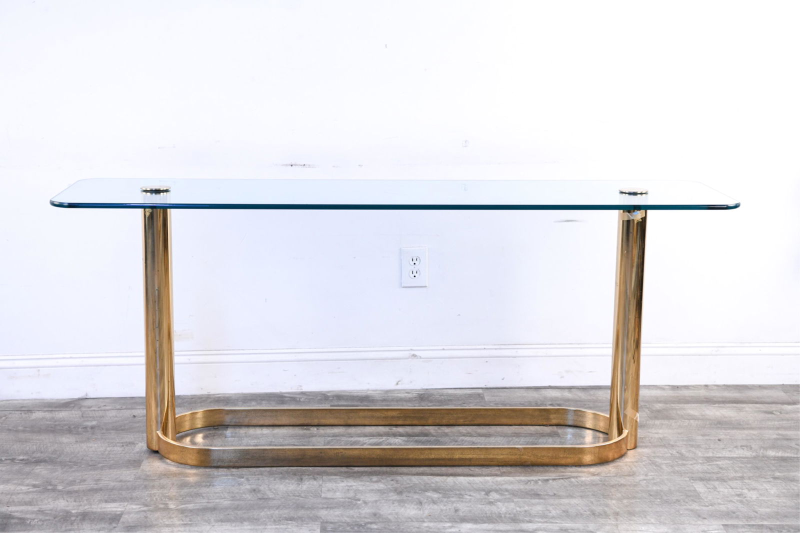 PACE COLLECTION BRASS AND GLASS CONSOLE TABLE: Dimensions: H 27" x W 66" x D 18" Condition: Showing signs of wear including scratches to brass.