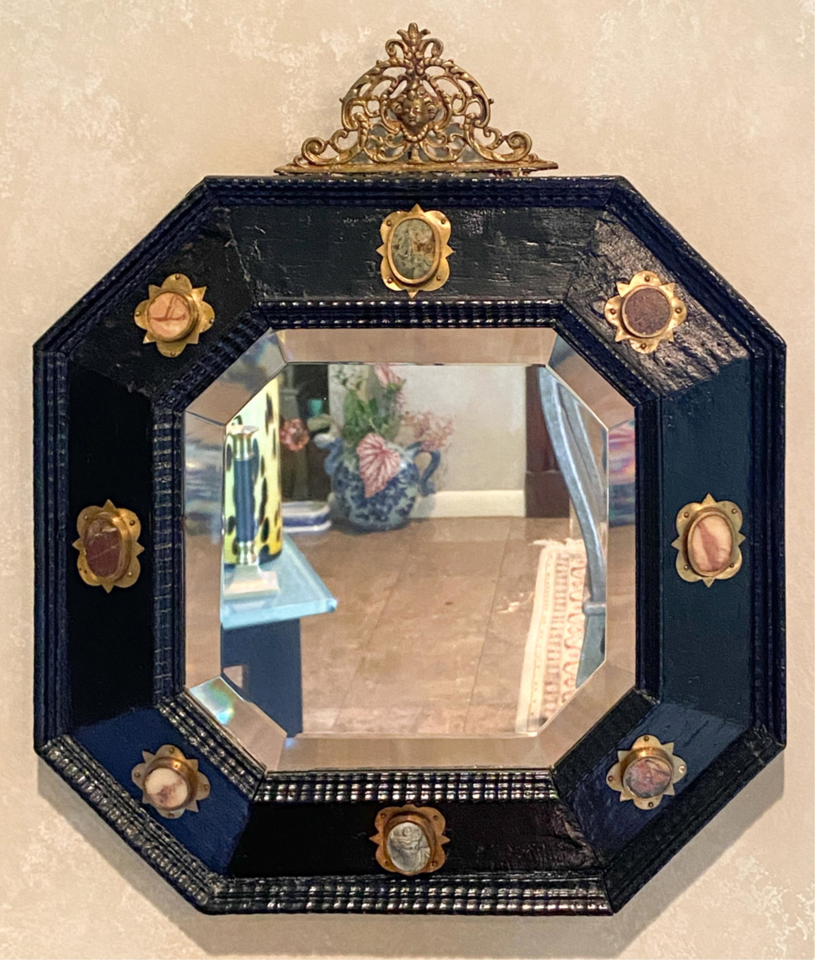 ANTIQUE EBONIZED AGATE & STONE FRAME MIRROR: Wood, agate or marble and a carved cameo with brass. Dimensions: H 20" x W 16.75" Condition: Top decoration needs re-attaching.