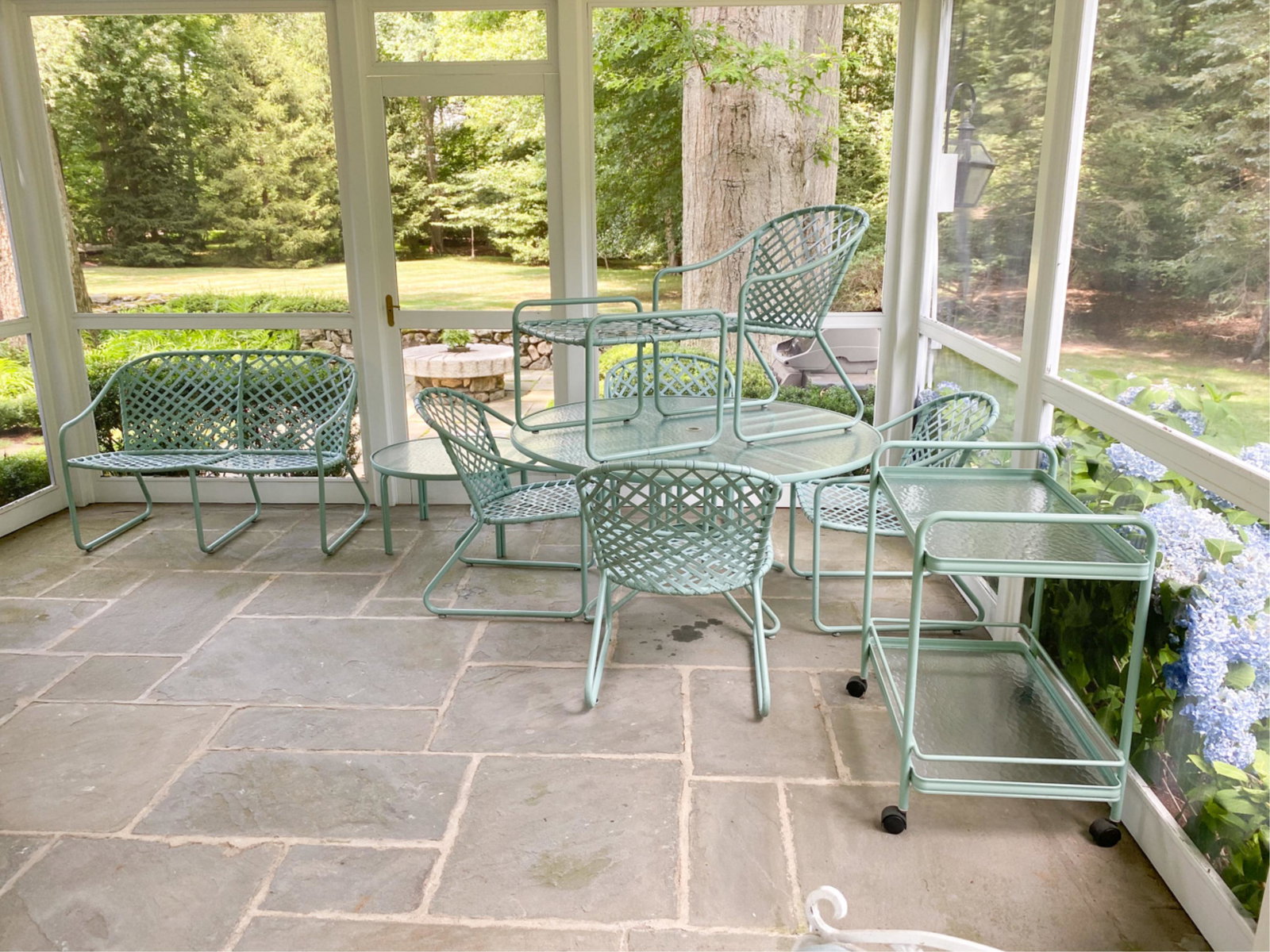 BROWN JORDAN OUTDOOR FURNITURE SUITE: Including bar cart, dining table, (5) chairs, ottoman, coffee table, and settee. Dimensions: (Dining table) H 26.25" x Dia. 54" Condition: Very light use.