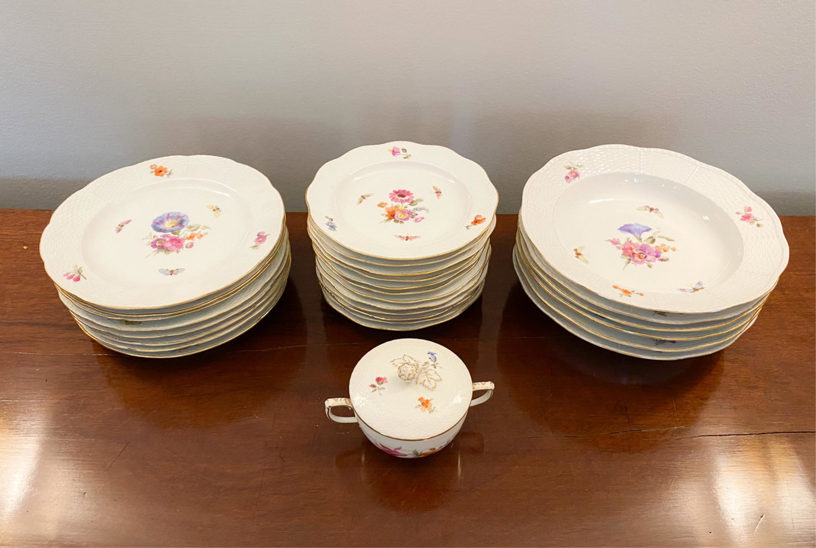GROUPING OF KPM PORCELAIN: Marked underneath. Dimensions: (Bowl) H 2" x Dia. 9.25", (Larger plate) Dia. 8.5", (Smaller plate) Dia. 7" Condition: Some minor wear to the gold on the edges. Chips to edges.