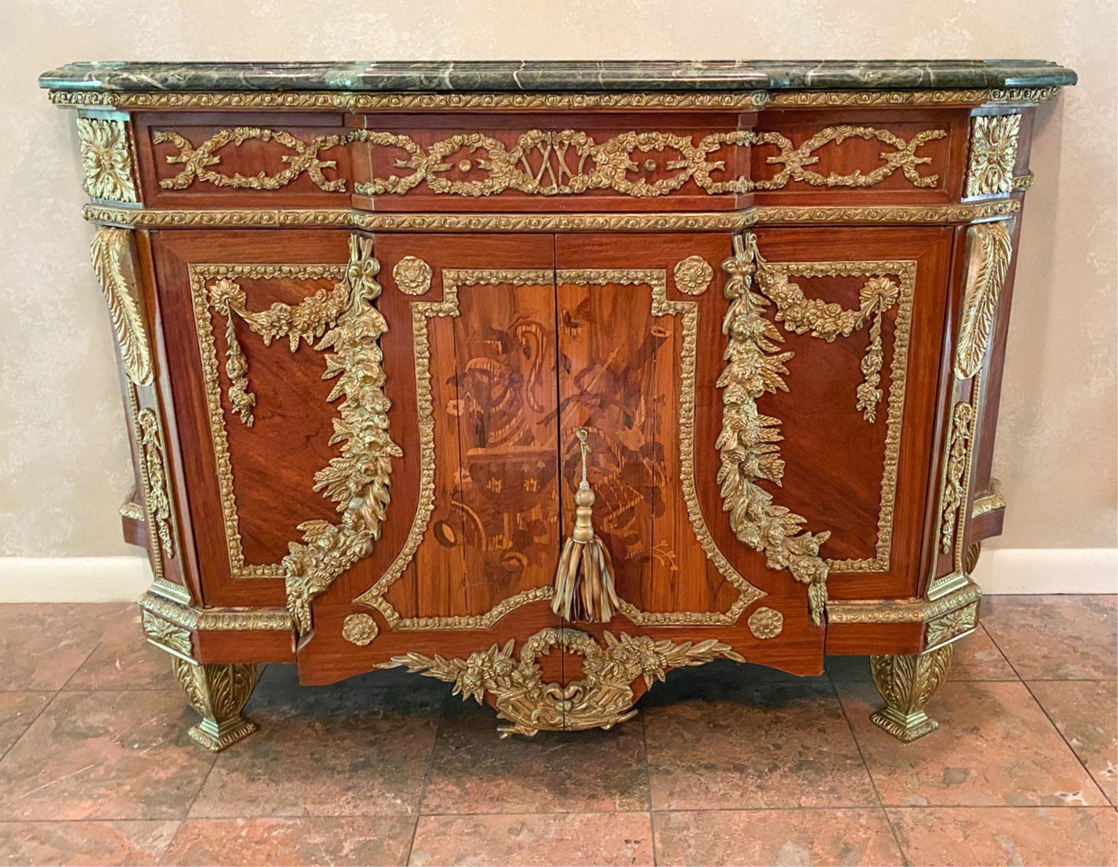 FRENCH INLAID AND ORMOLU MARBLE TOP CABINET: Dimensions: H 37" x W 62" x D 21.25" Condition: Few small chips to back edge of marble. Light scuffs to wood finish.