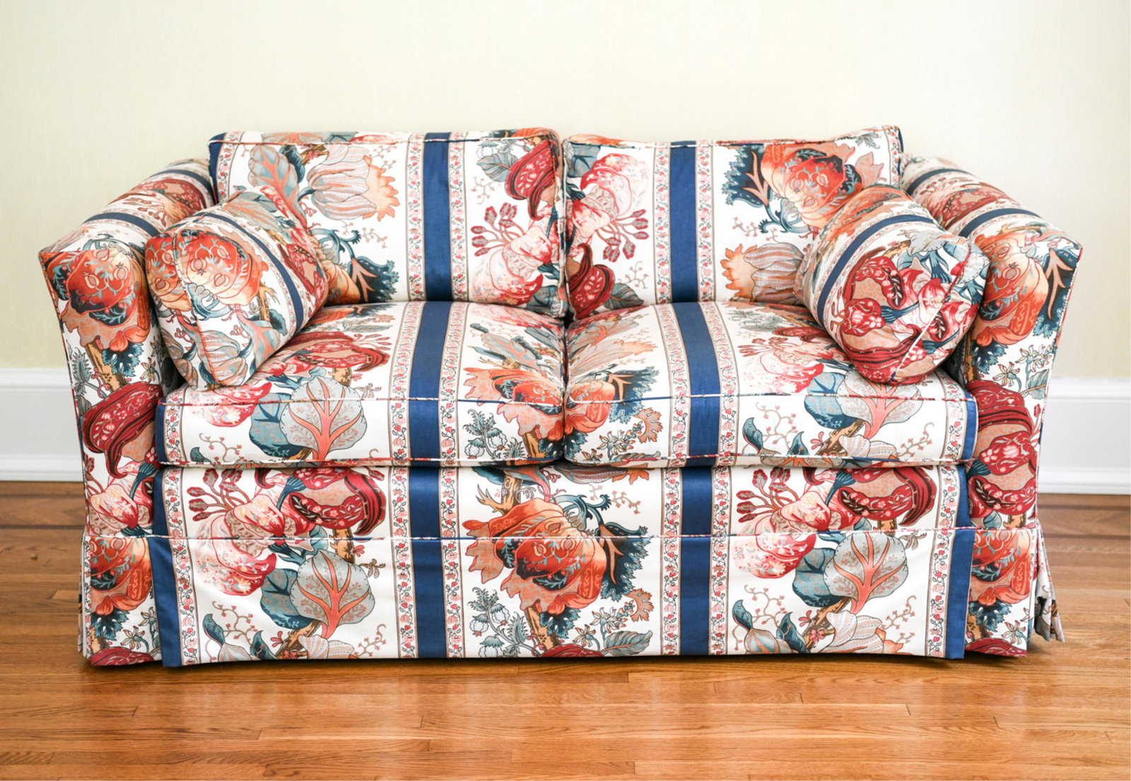 UPHOLSTERED LOVESEAT: Dimensions: H 26.25" x W 58.75" x D 33" x SH 18.75" Condition: Few small spots to the upholstery.