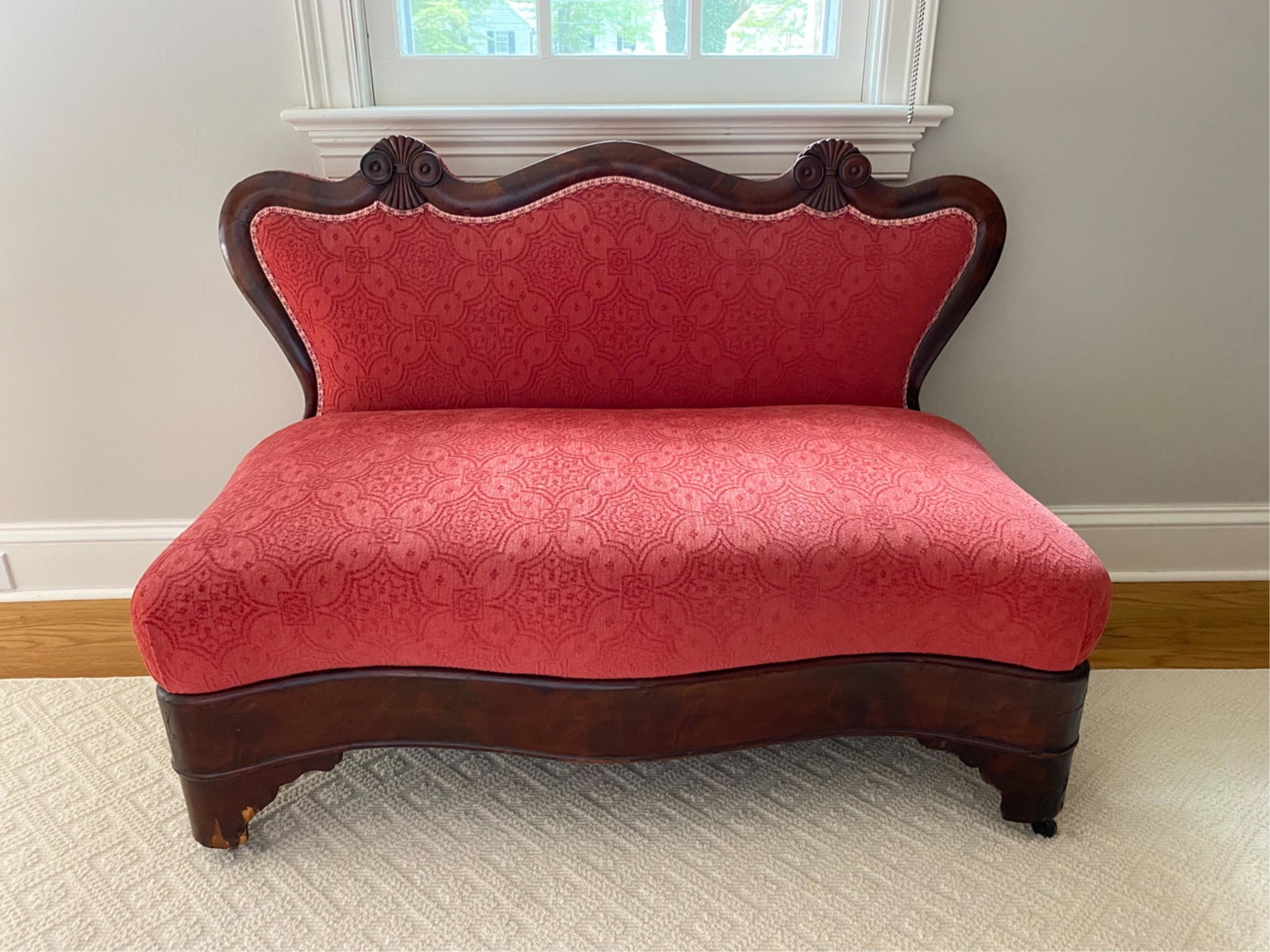 VICTORIAN DIMINUTIVE SOFA: On casters. Dimensions: H 29.5" x W 42" x D 22" x SH 15" Condition: Losses to veneer. Fading and wear to upholstery. Decent antique condition.