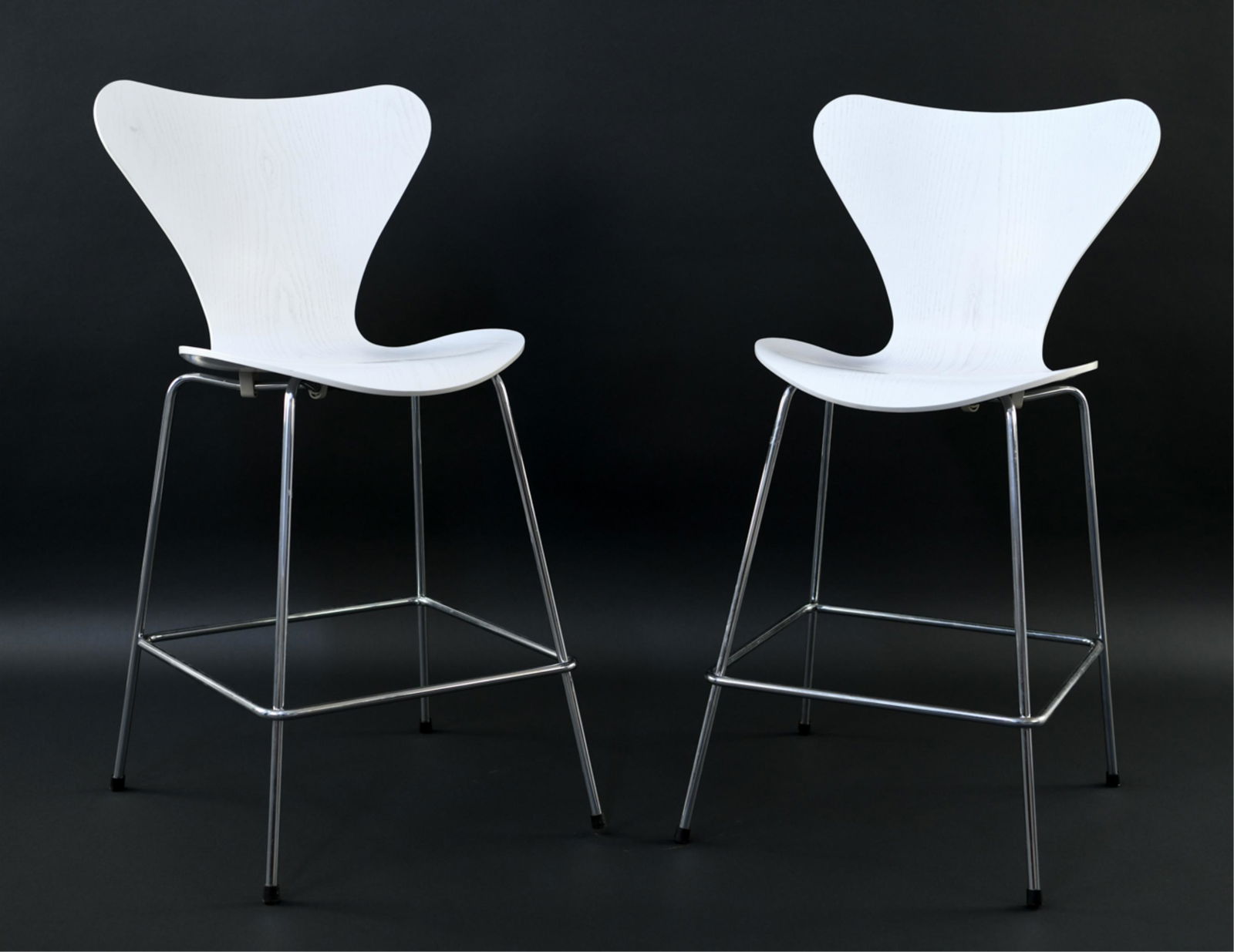 (2) FRITZ HANSEN BAR STOOLS: Dimensions: H 38.5" x W 18.5" x D 19.5" S.H. 26" Condition: Not original hardware. One screw broken in socket, Will need some attention