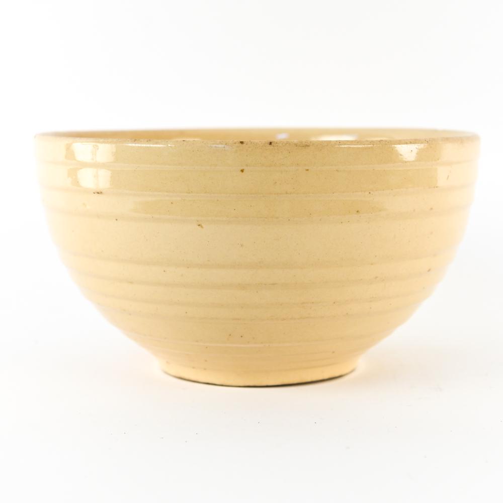 CERAMIC YELLOWARE BOWL: Dimensions: H 6.5" x Dia. 12.25" Condition: Rim chip. Few surface blemishes.