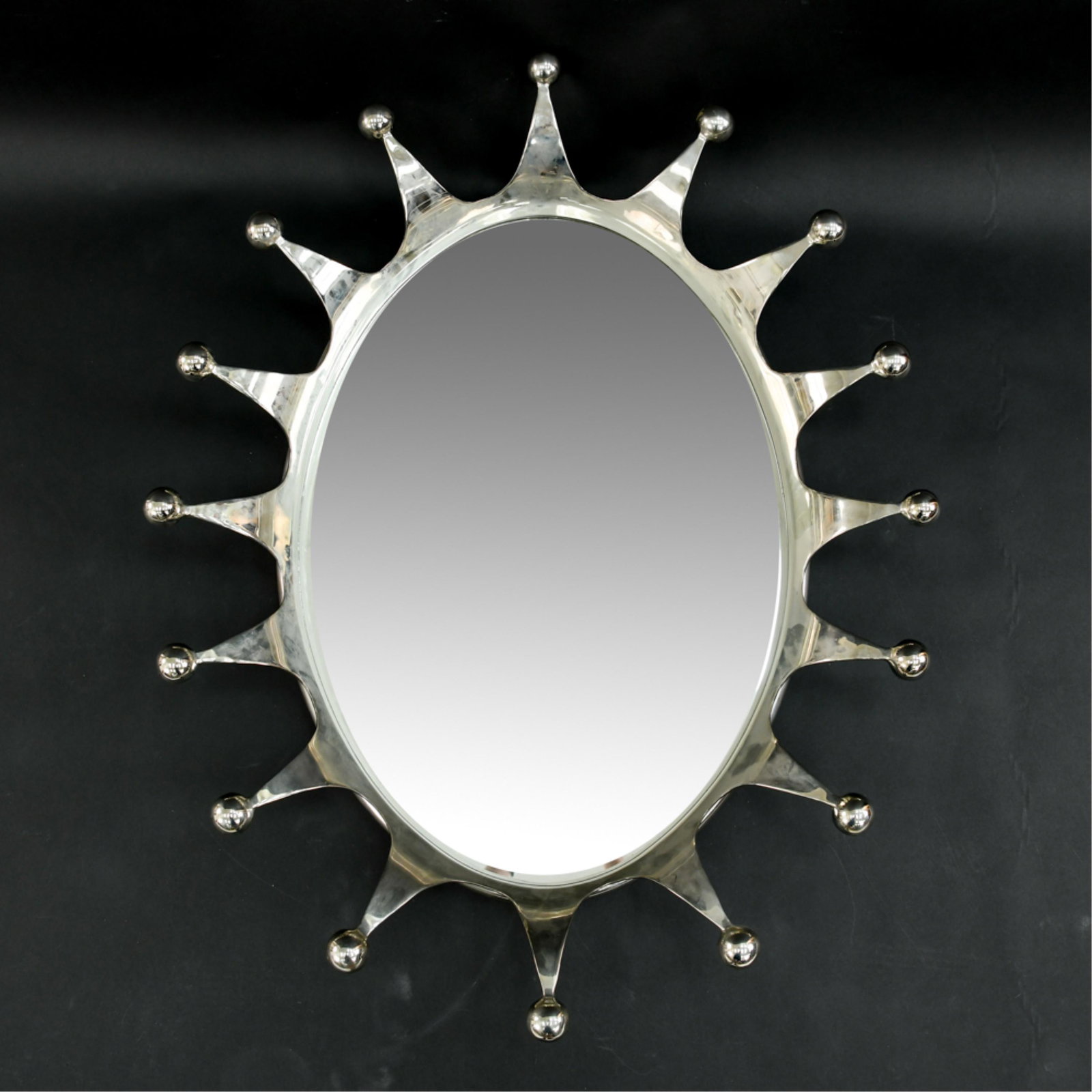 BLACKMAN CRUZ JESTER CROWN MIRROR: Polished aluminum. Originally $4681.00. Dimensions: H 41" x W 31" Condition: Couple small handling marks.