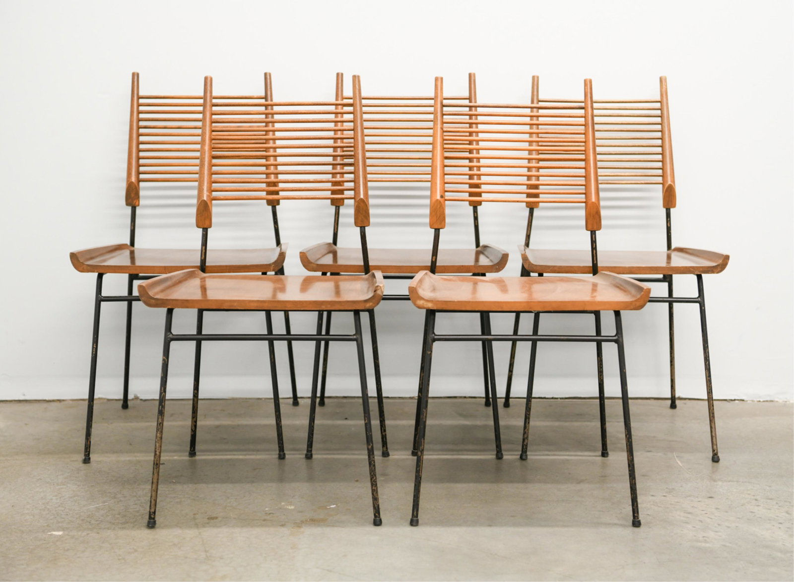(5) PAUL MCCOBB SHOVEL DINING CHAIRS: One with label remnants underneath. Dimensions: H 33.75" x W 18.25" x D 18.5" x SH 17.75" Condition: Finish wear consistent with age and use including scratches, dings, corner chip, crack to one chair
