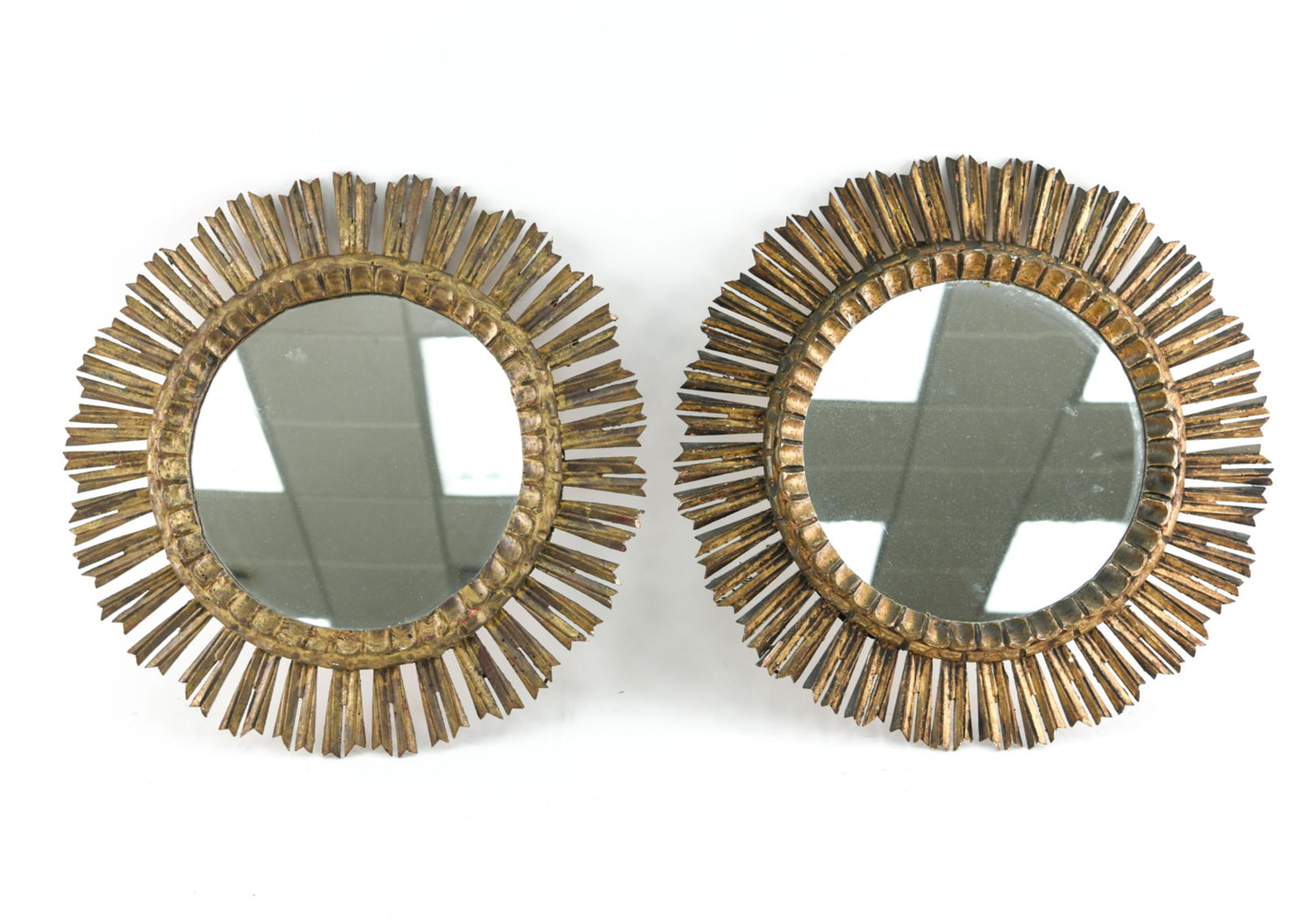 PAIR OF GILTWOOD SUNBURST FORM MIRRORS: Dimensions: Dia. 24.5" Condition: Small losses to edges of rays.