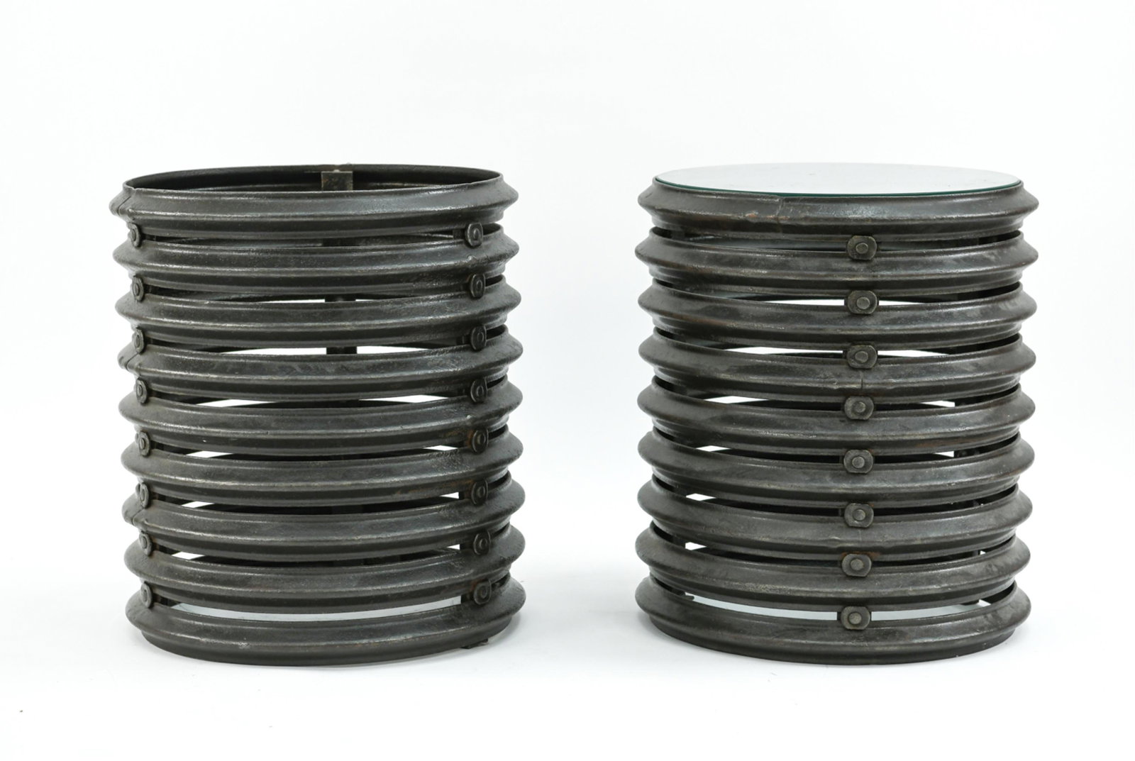PAIR OF IRON AND GLASS SIDE TABLES: One with glass top. Dimensions: H 22" x Dia. 19.5" Condition: One lacking glass.