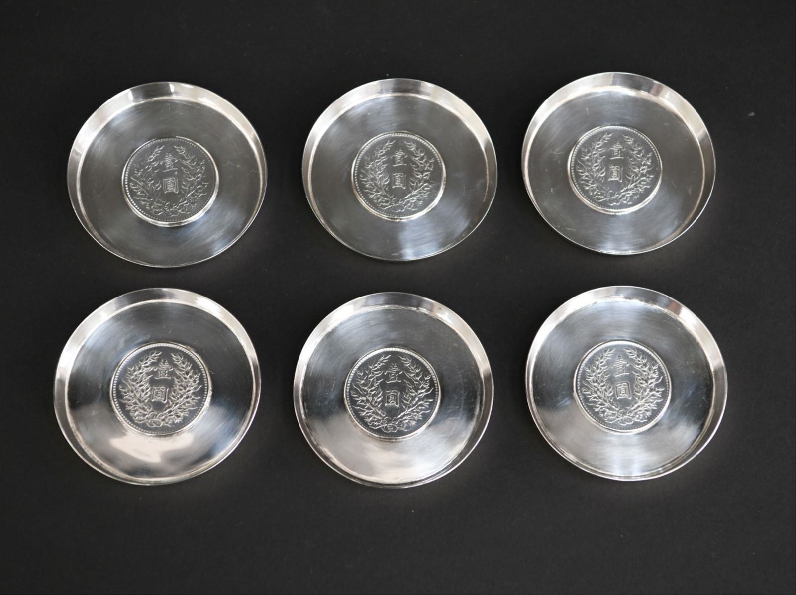 JAPANESE STERLING SILVER COASTERS: (6) coasters marked: Tackhing sterling Made in Hong Kong. Dimensions: H 0.50" x Dia: 3.25" Weight: 13 ozt Condition: Minor surface scratching.