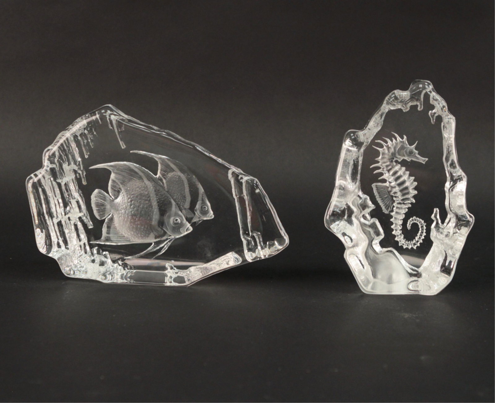 ORREFORS EDGED GLASS BOOKENDS: (2) paperweights, one of fish the other of a seahorse, both signed under. Dimensions: H 5" x W 7.4" x D 2" Condition: No issues to note.