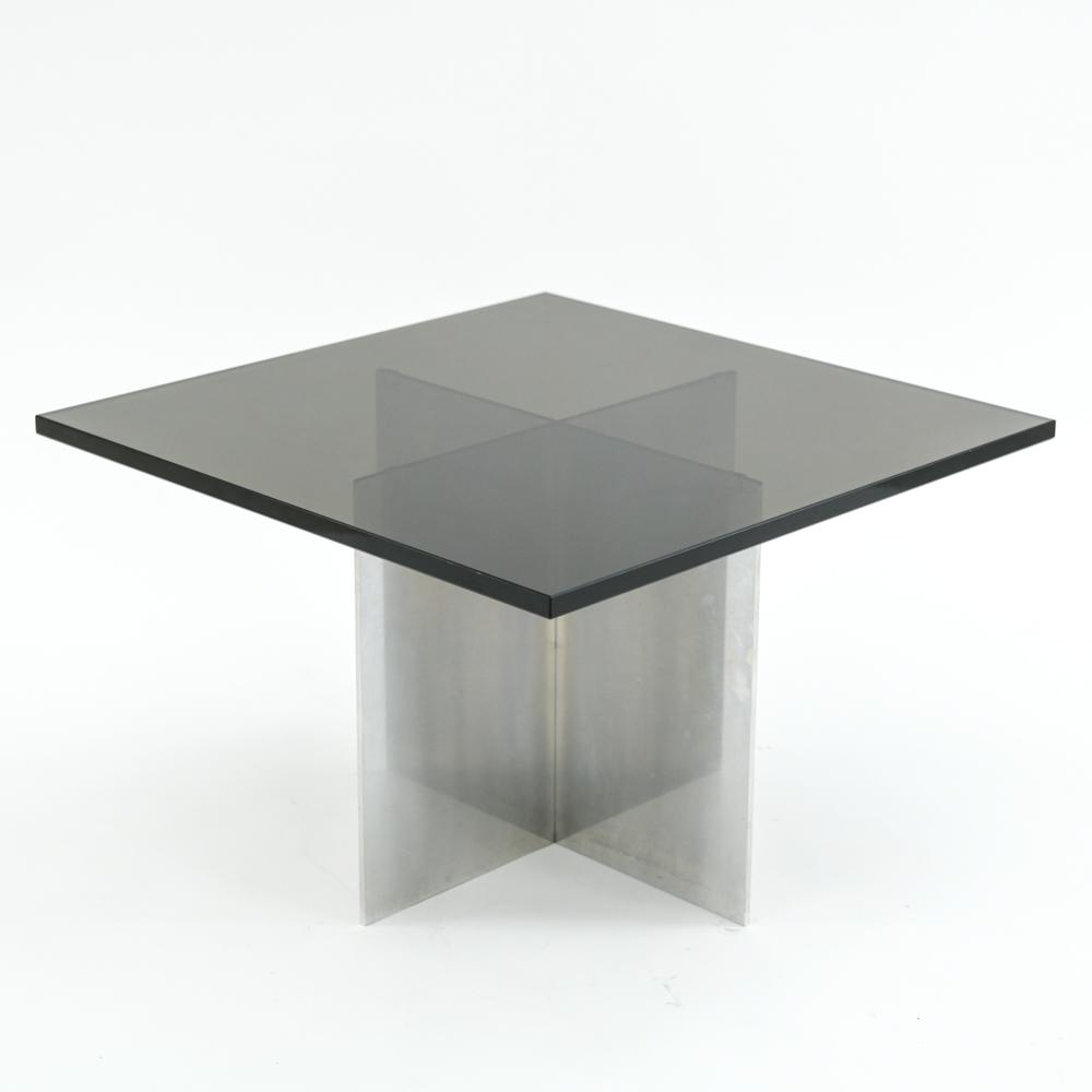 PAUL MAYEN, HABITAT ALUMINUM X-BASE COFFEE TABLE: With original 3/4" black glass top. Paul Mayen for Habitat. Dimensions: H 15.75" x W 24" x D 24" Condition: Couple flea bites. Couple areas with early signs of pitting to base.