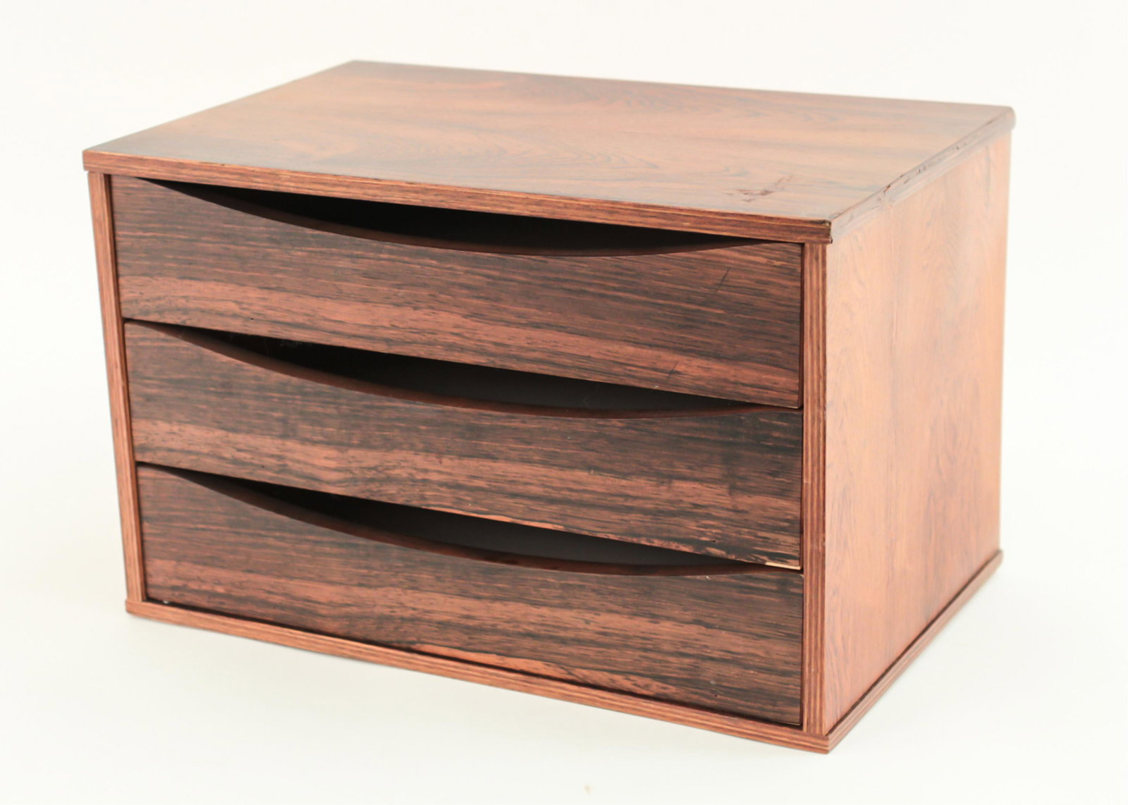 SWEDISH ROSEWOOD DESK ORGANIZER: Marked underneath: Made in Sweden. Dimensions: H 10" x W 15.5" x D 10.25" Condition: Small veneer loss to one drawer front. Light use wear. Residue spot to one side.