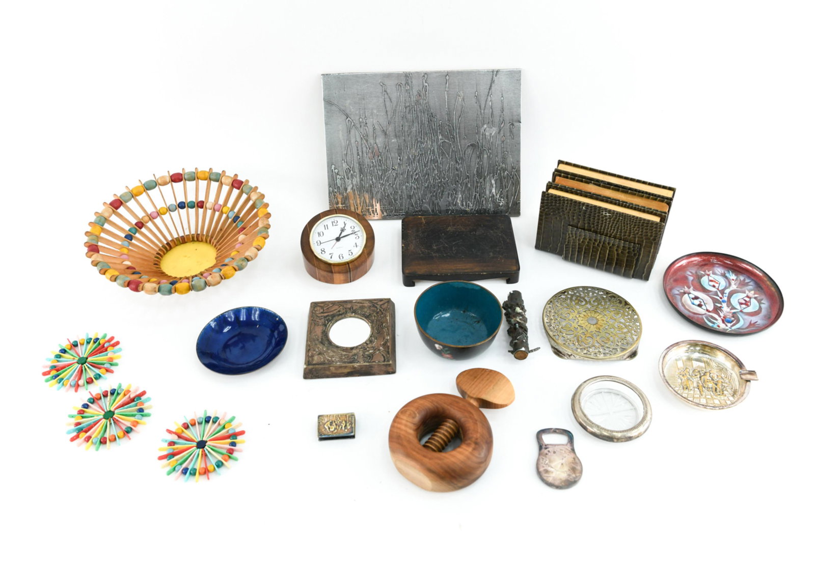 DECORATIVE GROUPING: Including wooden beaded basket and coasters, clock, books, etc. Dimensions: (Basket) H 3.5" x Dia. 10.25" Condition: Varying degrees of wear.