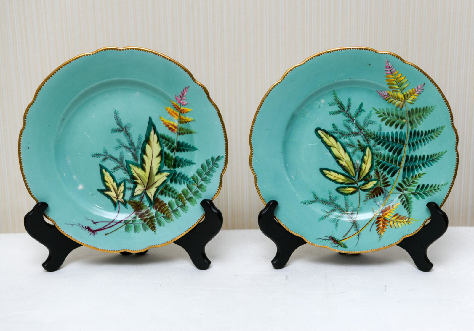 PAIR OF 19TH C. MINTON PLATES: With paint decoration of ferns. Scalloped edge. Apparently unmarked. Dealer label state c. 1824. Dimensions: H .75" x Dia. 9" Condition: Rubbing. Loss to decoration.