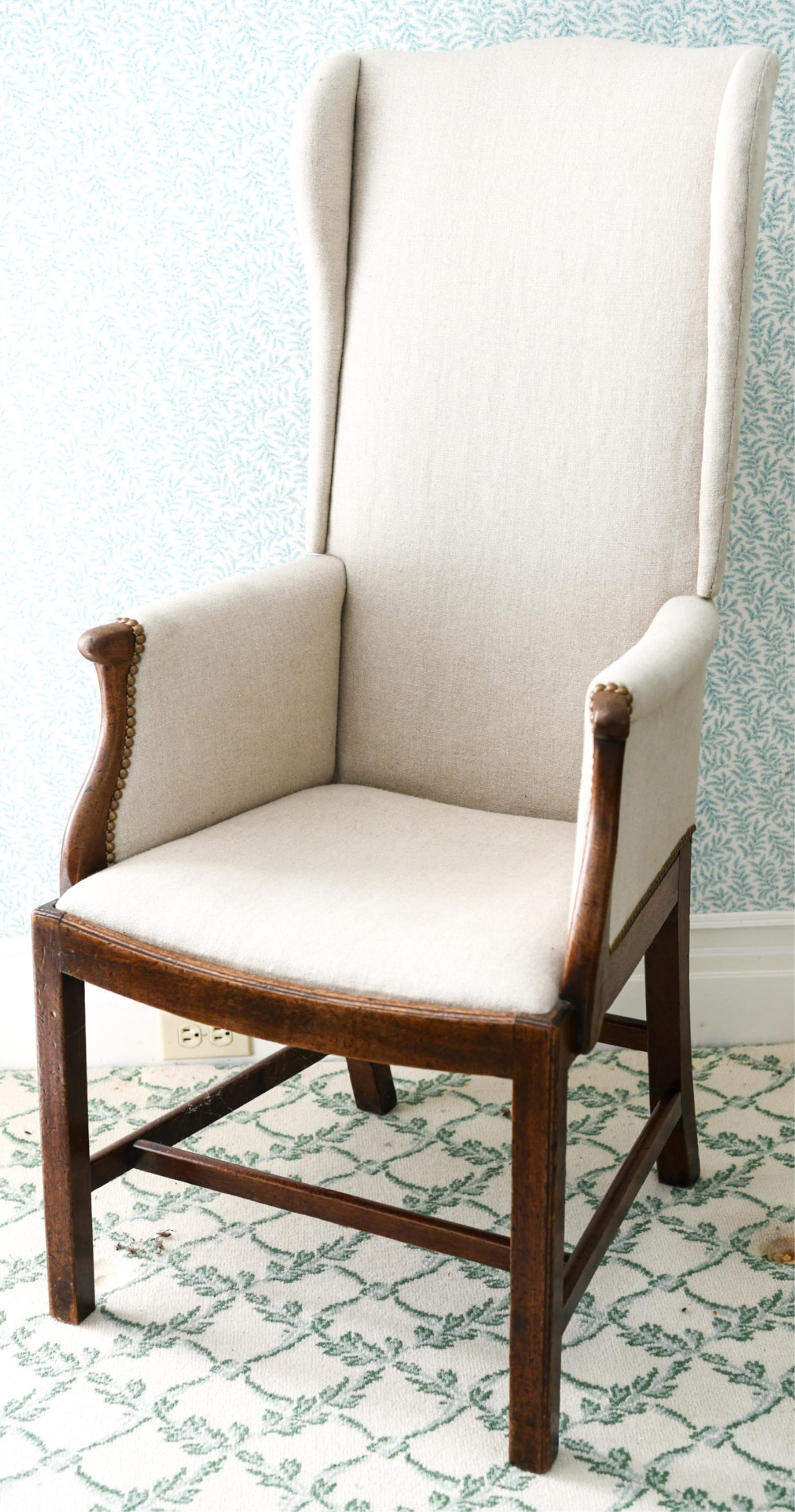 18TH C. WINGBACK CHAIR: With adjustable back. Recent upholstery, brass tacks. Narrow high back form. Dimensions: H 48.25" x W 22.75" x D 22" x SH 18" Condition: Light wear to wood frame including surface marks.