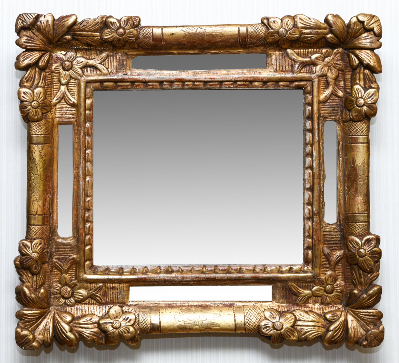 GILT FRAME MIRROR: Carved and gilded with mirrored inserts. Dimensions: H 16.5" x W 18" Condition: Faux antiqued.