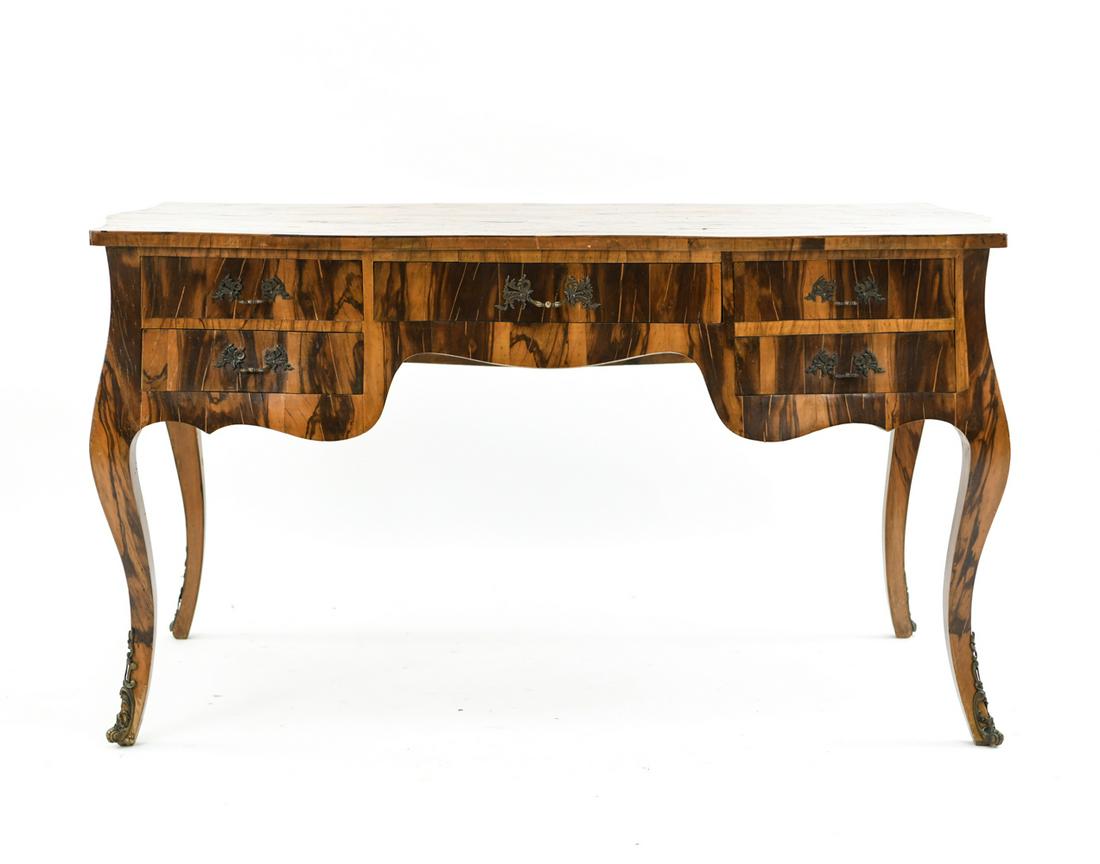 ROCOCO STYLE BURL WOOD VENEER DESK: Dimensions: H 31.5" x W 55.5" x D 27.25" Condition: Splits to wood. Scuffs and finish loss.