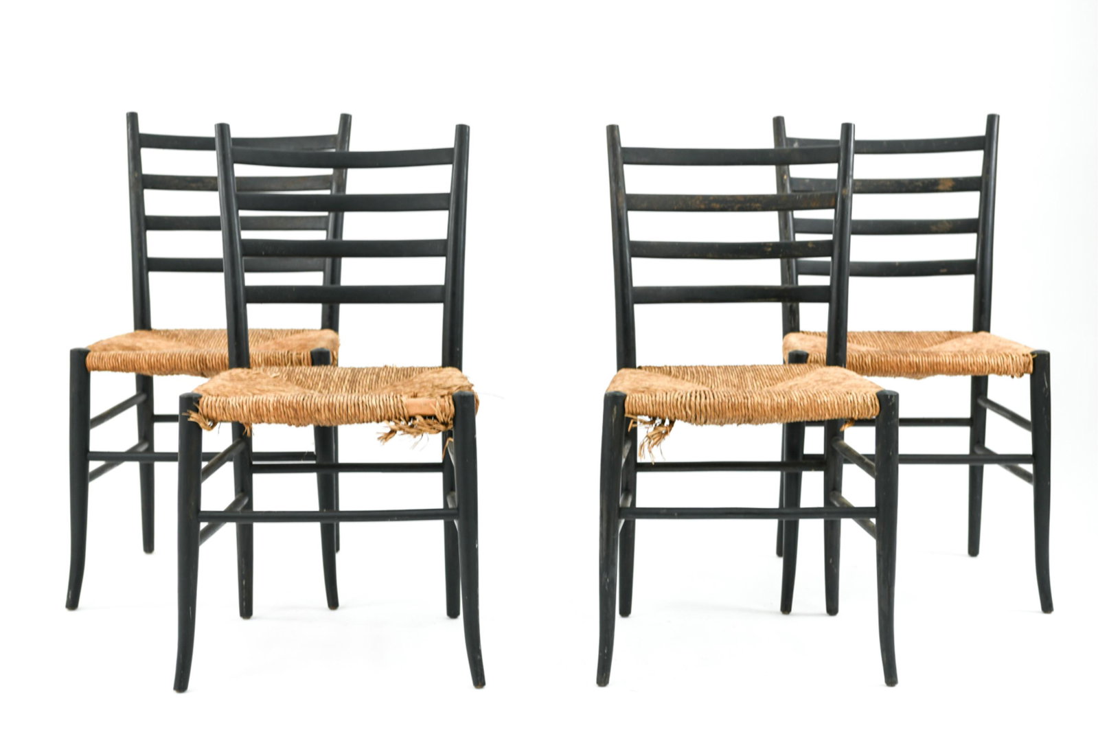 (4) BLACK LACQUER AND RUSH SEAT DINING CHAIRS: Dimensions: H 33” x W 15.5” x D 16.5” x SH 17” Condition: Wear to lacquer including losses to rush seating consistent with age and use.