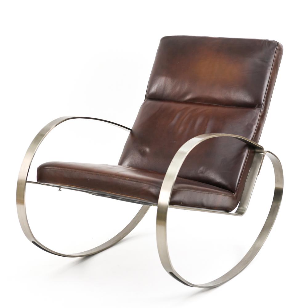 CHROME AND LEATHER ROCKING CHAIR: C. 2000 Brushed, flat-bar chrome and brown leather. No labels. Dimensions: H 35.5" x W 26" x D 39" x SH 19" Condition: Signs of use including light creasing to leather. Surface scratches to metal.