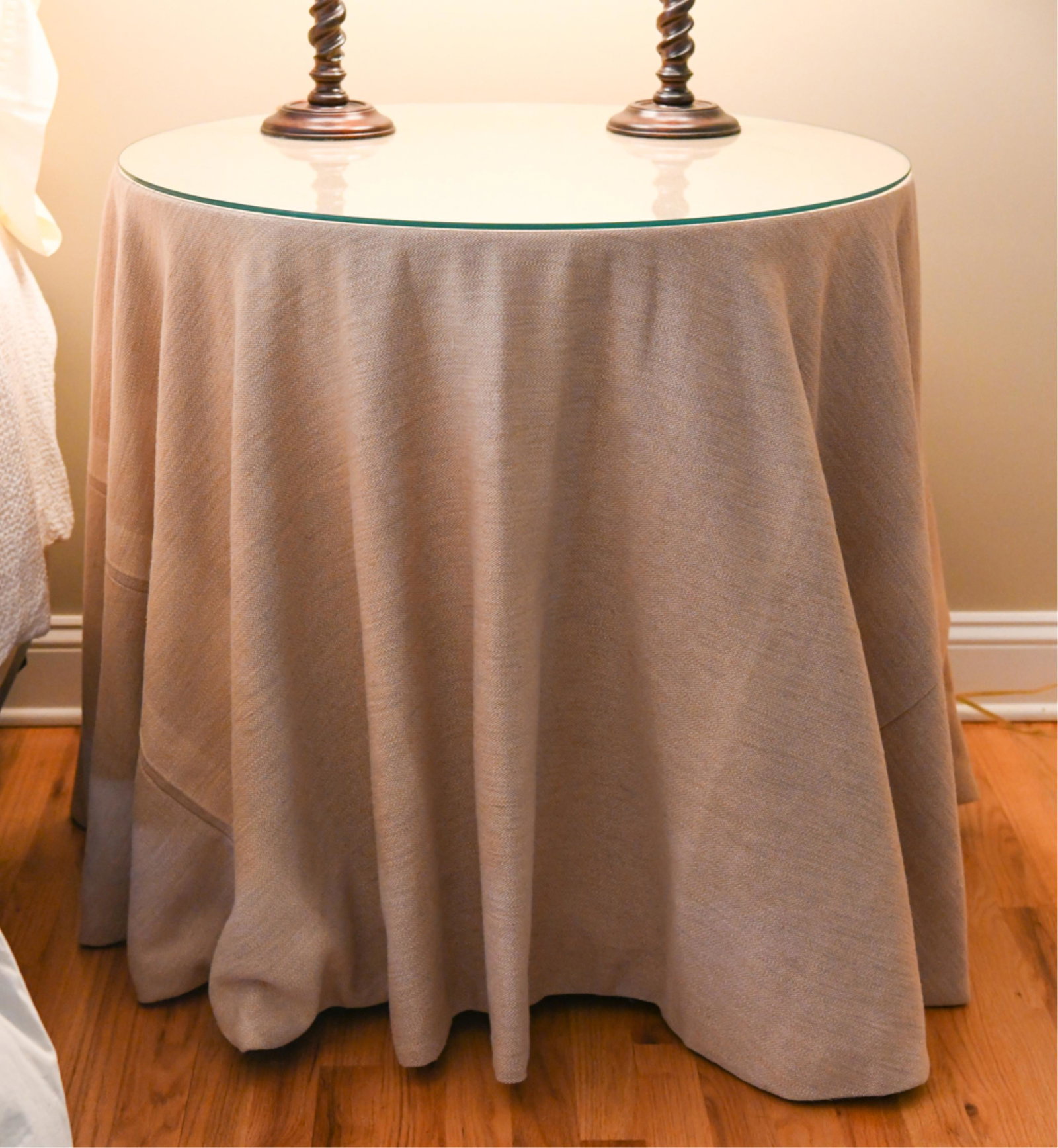 SLIP COVER TABLE: With matching pillows, and curtains Dimensions: H 30.5" x Dia. 30.25" Condition: Few flea bites to glass.