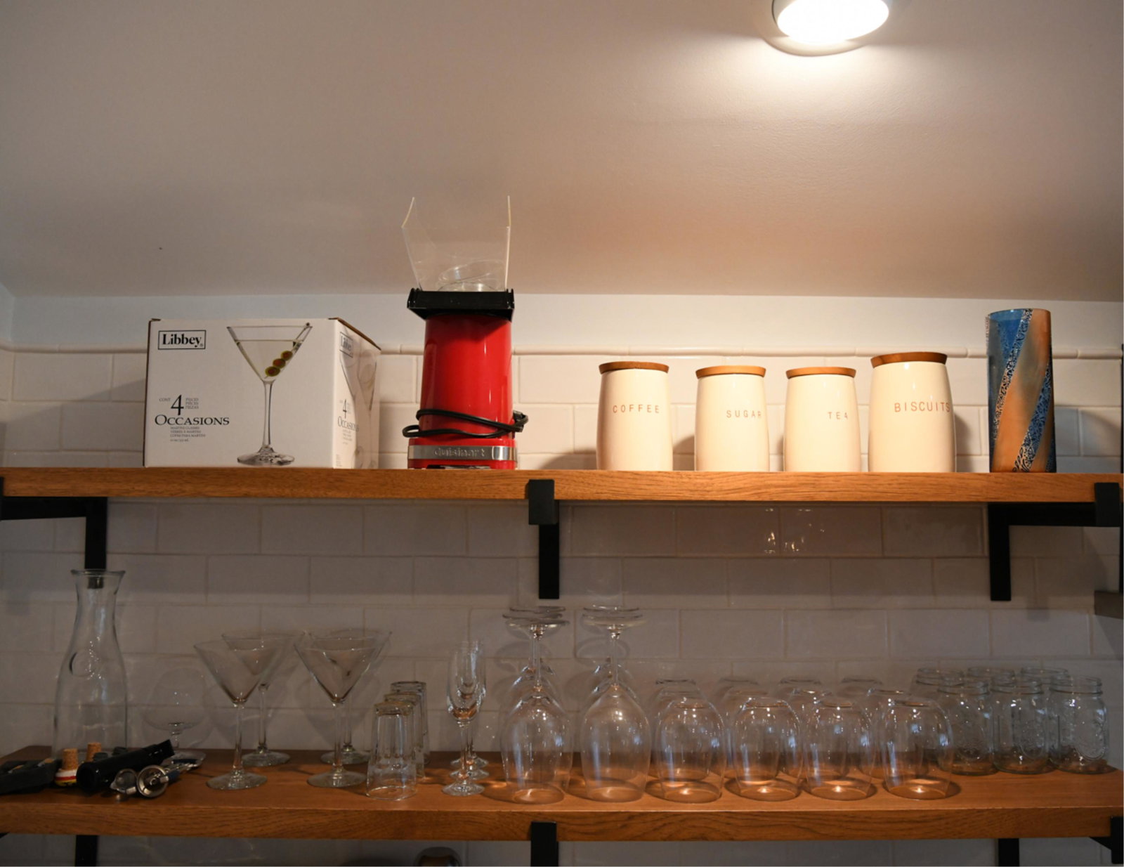 GROUPING OF KITCHENWARE: Including glassware, bottle openers, stoppers, canisters, etc. Dimensions: (Wine glass) H 9" x Dia. 4" Condition: All used, with signs of use.