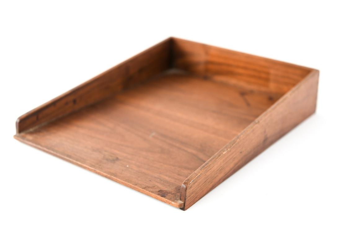 JENS RISOM WALNUT PAPER TRAY: Marked with decal. Dimension: H 3” x W 11” x D 14.25” Condition: Showing signs of age and use including marks. Missing feet. Small loss to inner edge of base.