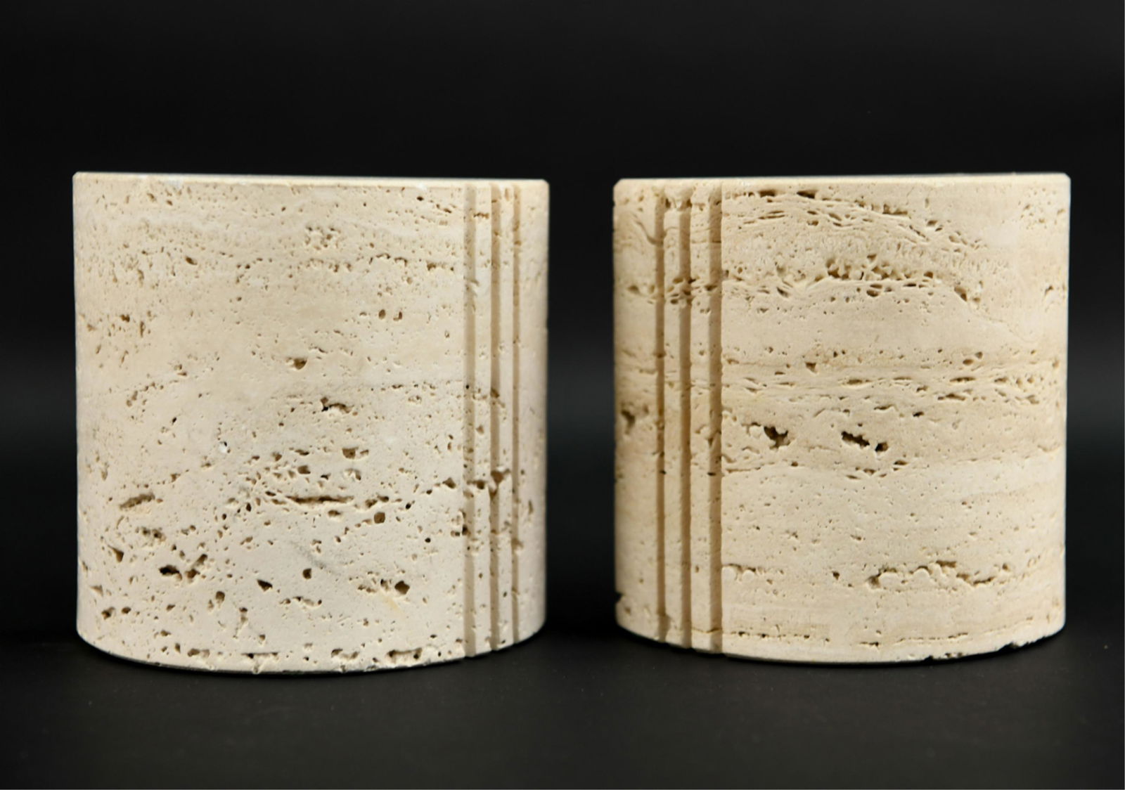 PAIR OF RAYMOUR TRAVERTINE BOOKENDS: Dimensions: H 6" x W 6" x D 3" Condition: Handling marks including a small loss to one lower corner.