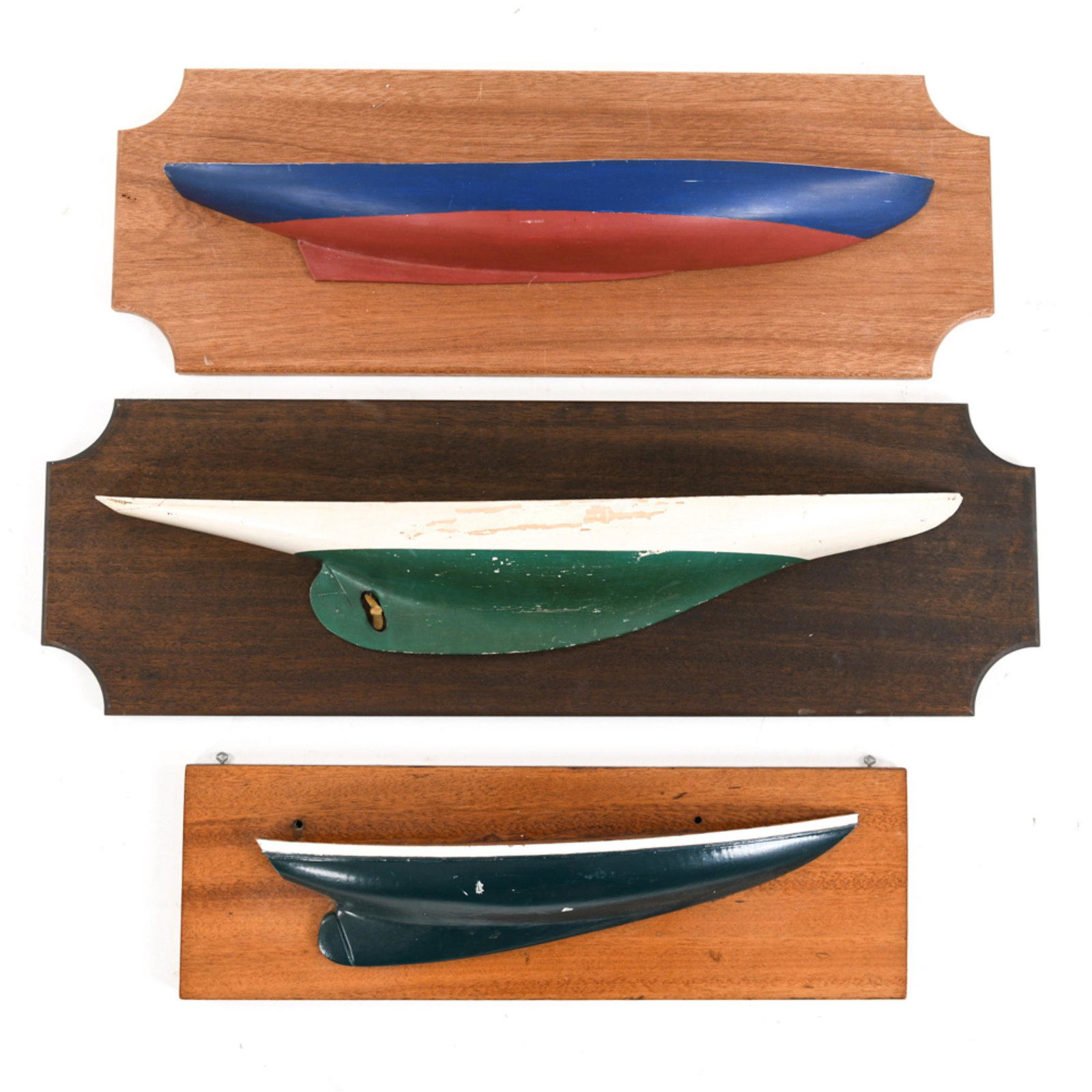 GROUPING OF HALF HULLS: Dimensions: (Largest) H 10" x W 31" x D 4" Condition: Some areas with scratches and light handling marks to mounting boards. Crazing and some flaking to white and green half hull paint finish.