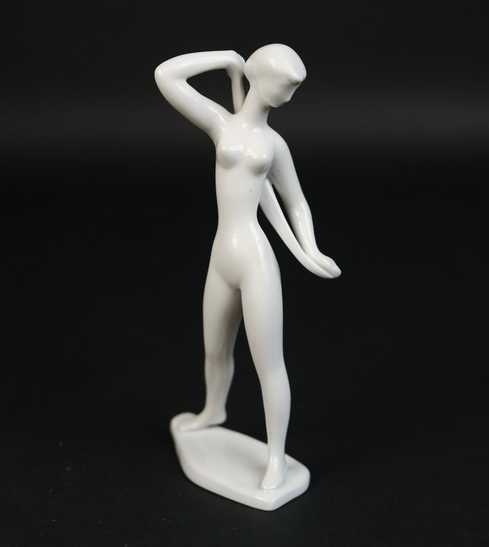 MODERNIST ART DECO PORCELAIN FEMALE NUDE DANCER: With stamps to bottom. Royal Dux or German style. Dimensions: H 7.75" x W 3.5"x D 2.5" Condition: No issues to note.