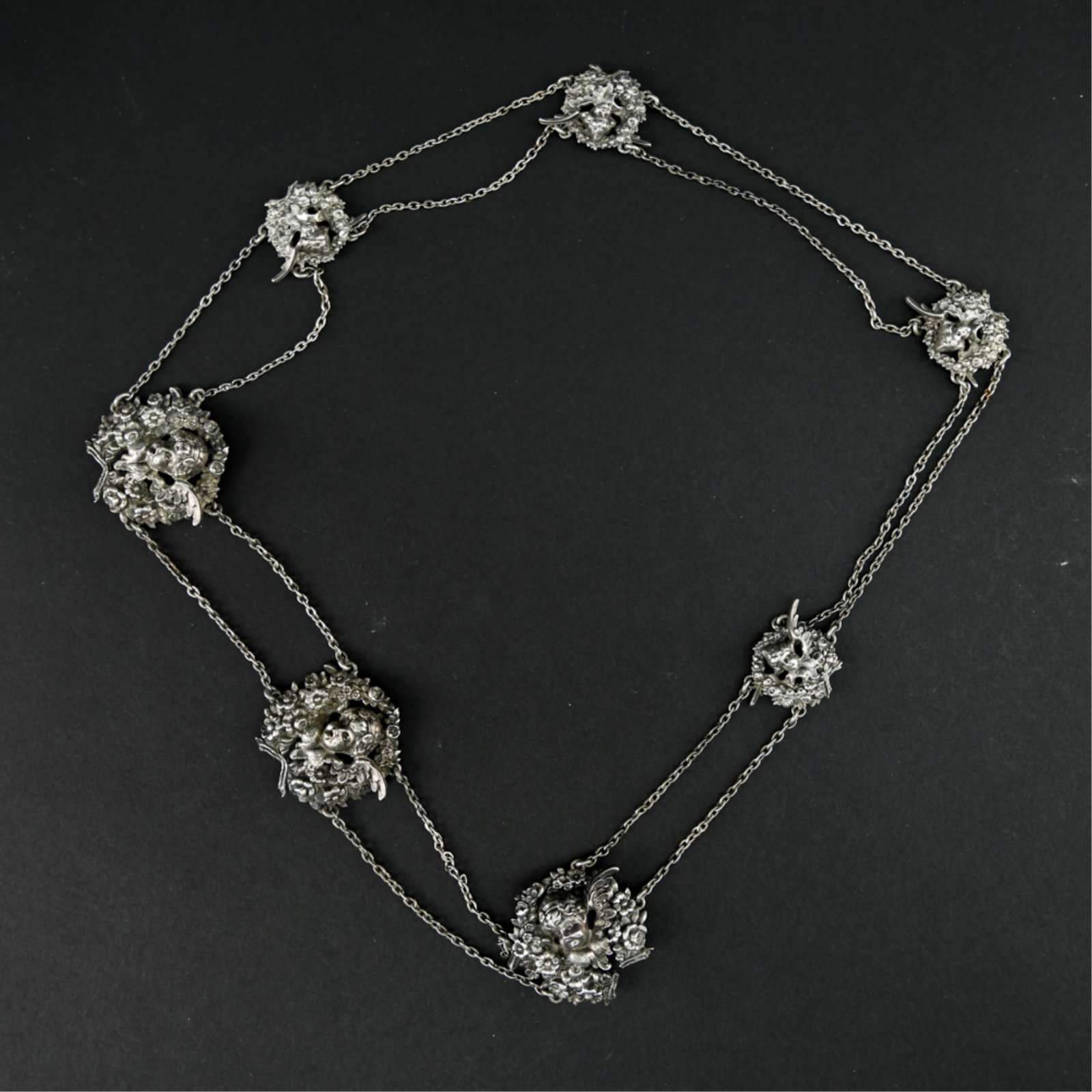STERLING PUTTI BELT: Hallmarked sterling with a number and a partial symbol hallmark. Dimensions: L 33" x W 1.75" Weight: 3.17 ozt Condition: Showing light signs of use.
