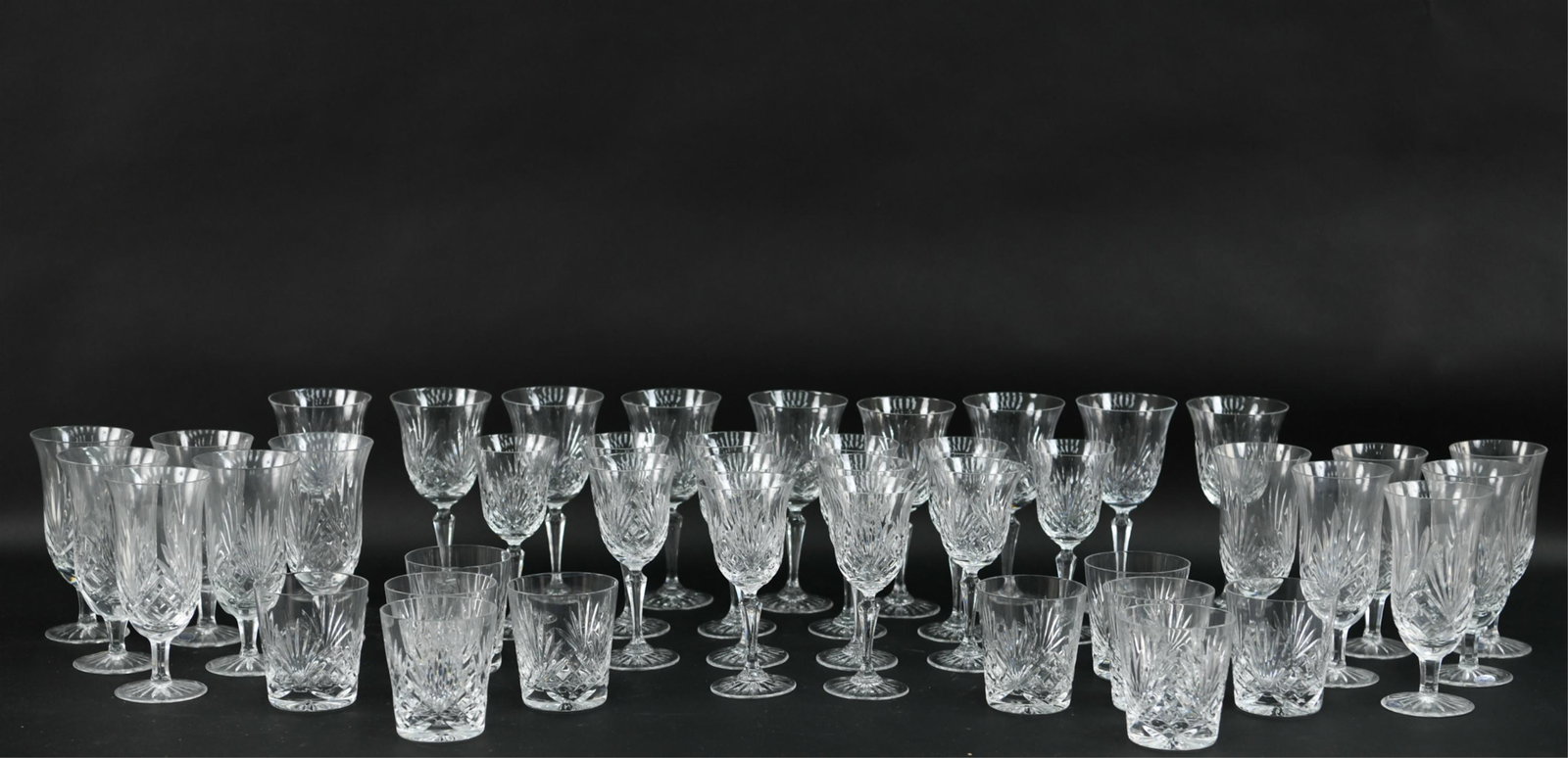 EXTENSIVE SET ROGASKA CRYSTAL: Includes (12) tall water glasses, (12) tall wine, (12) short wine, and (11) short liquor glasses. Two sets come in padded case. Dimensions: (Tallest) H 7.25" Condition: Short liquor glasses with chips