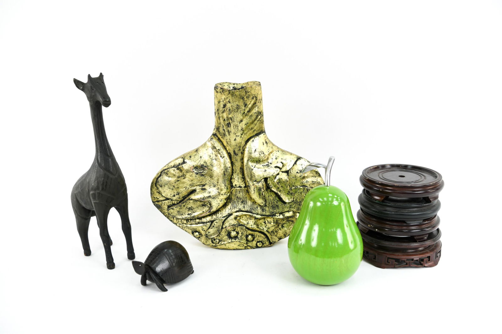 GROUPING OF WOODEN DECORATIVE OBJECTS: Including giraffe, pear, turtle, Asian stands, vase. Dimensions: H 13.5" x W 15.5" x D 3" Condition: Some paint loss to vase. Repairs to giraffe's ears. Light surface wear.