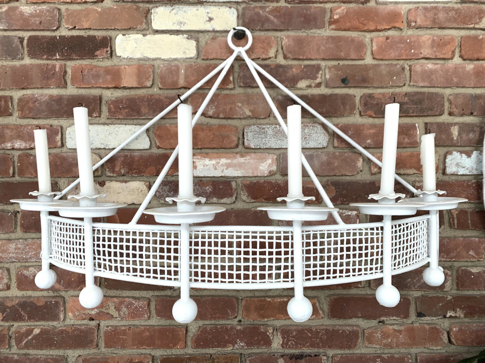 IRON WALL MOUNT SCONCE CANDELABRA: Dimensions: H 25" x W 39" x D 15" Condition: Wear consistent with use including some areas of peeling and flaking paint.
