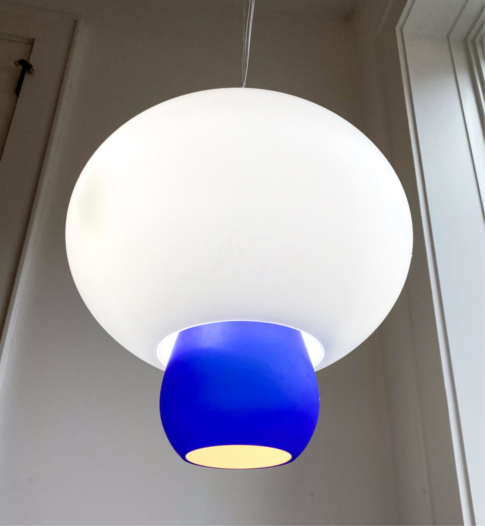 MODERNIST GLASS PENDANT LAMP: Base of frosted blue and white glass globes Suspended from wire Dimensions: (of globes) H 15" x Dia. 14" Condition: Some surface dirt