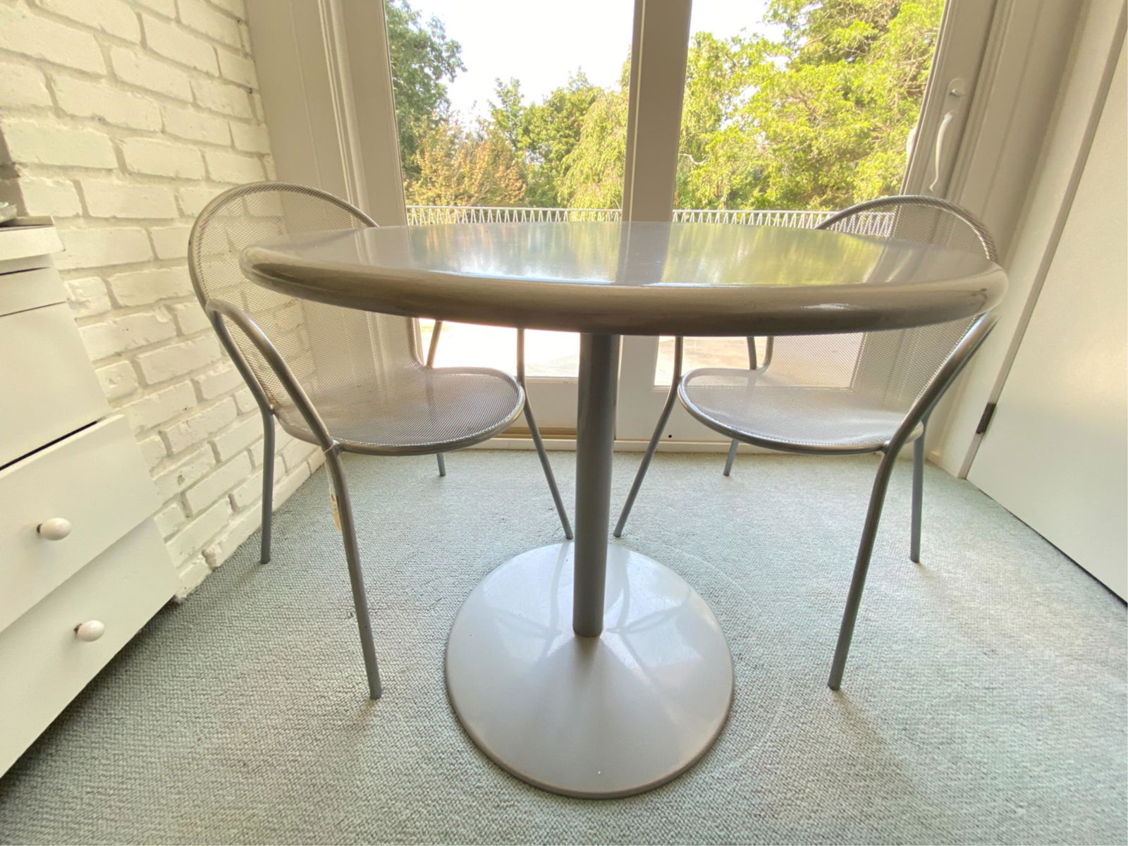 METAL TABLE AND MESH CHAIRS BISTRO SET: Dimensions: (table) H 29" x Dia. 32" Condition: Surface scuffing, staining, some rust on chairs.