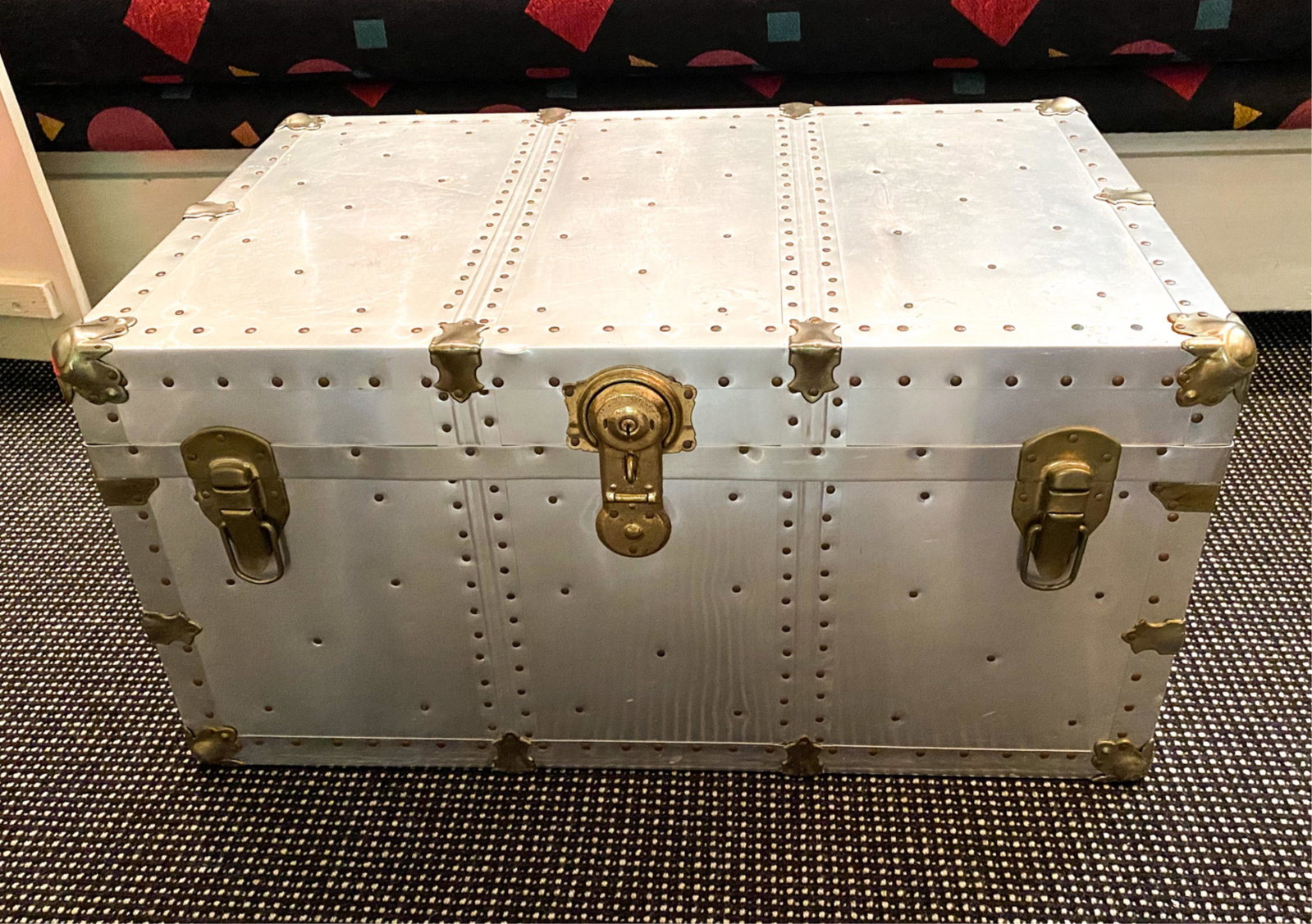 ALUMINUM CLAD TRUNK: locked and Key not included Dimensions: H 16.25" x W 32" x D 20.5" Condition: Some dents and scratches
